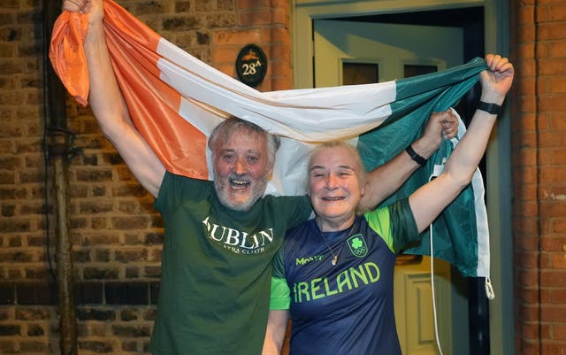 <p>Kellie Harrington’s parents Yvonne and Christy Harrington celebrate in Dublin (Niall Carson/PA)</p>