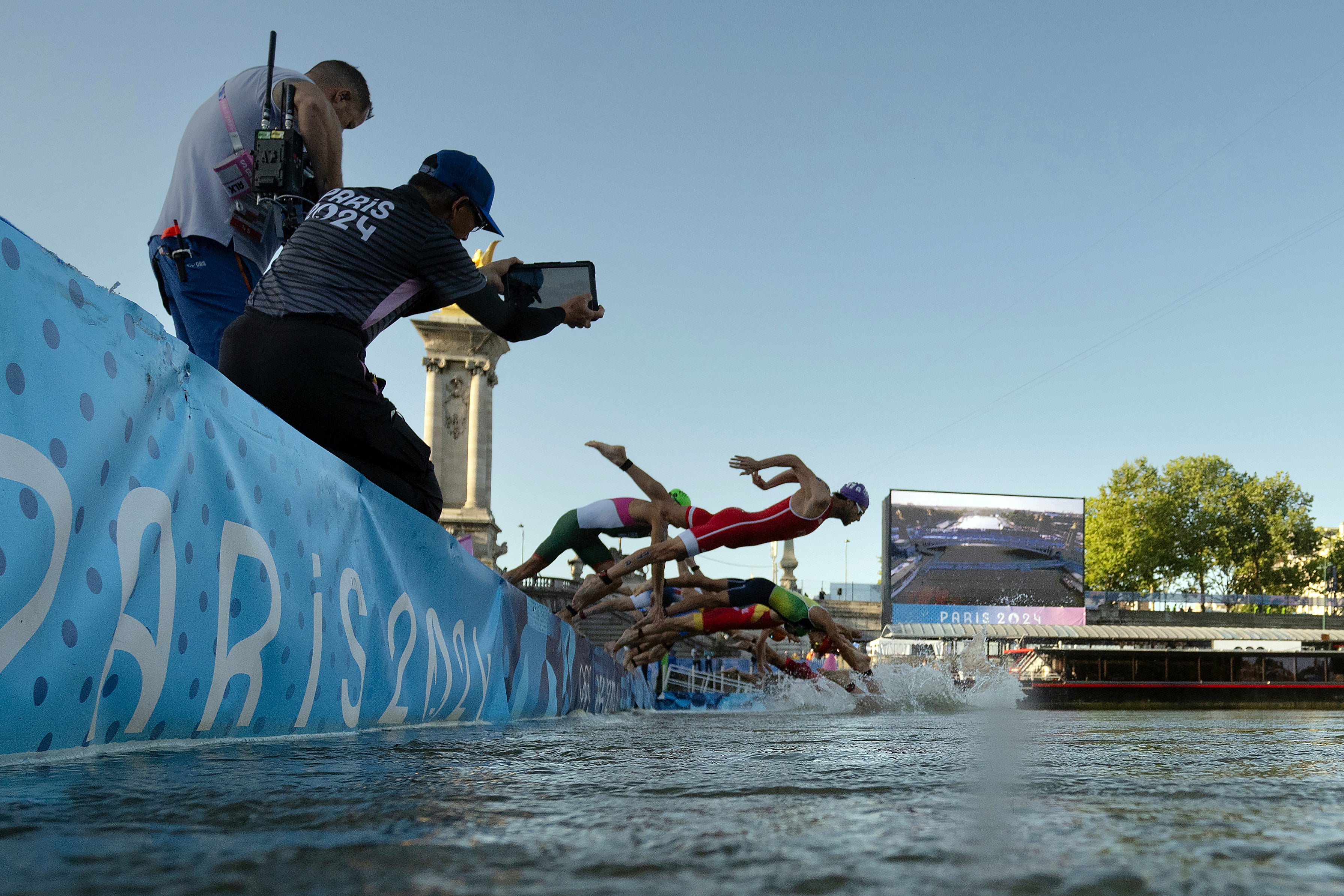 Olympic swimmers are guzzling cans of Coke to protect from pollution in