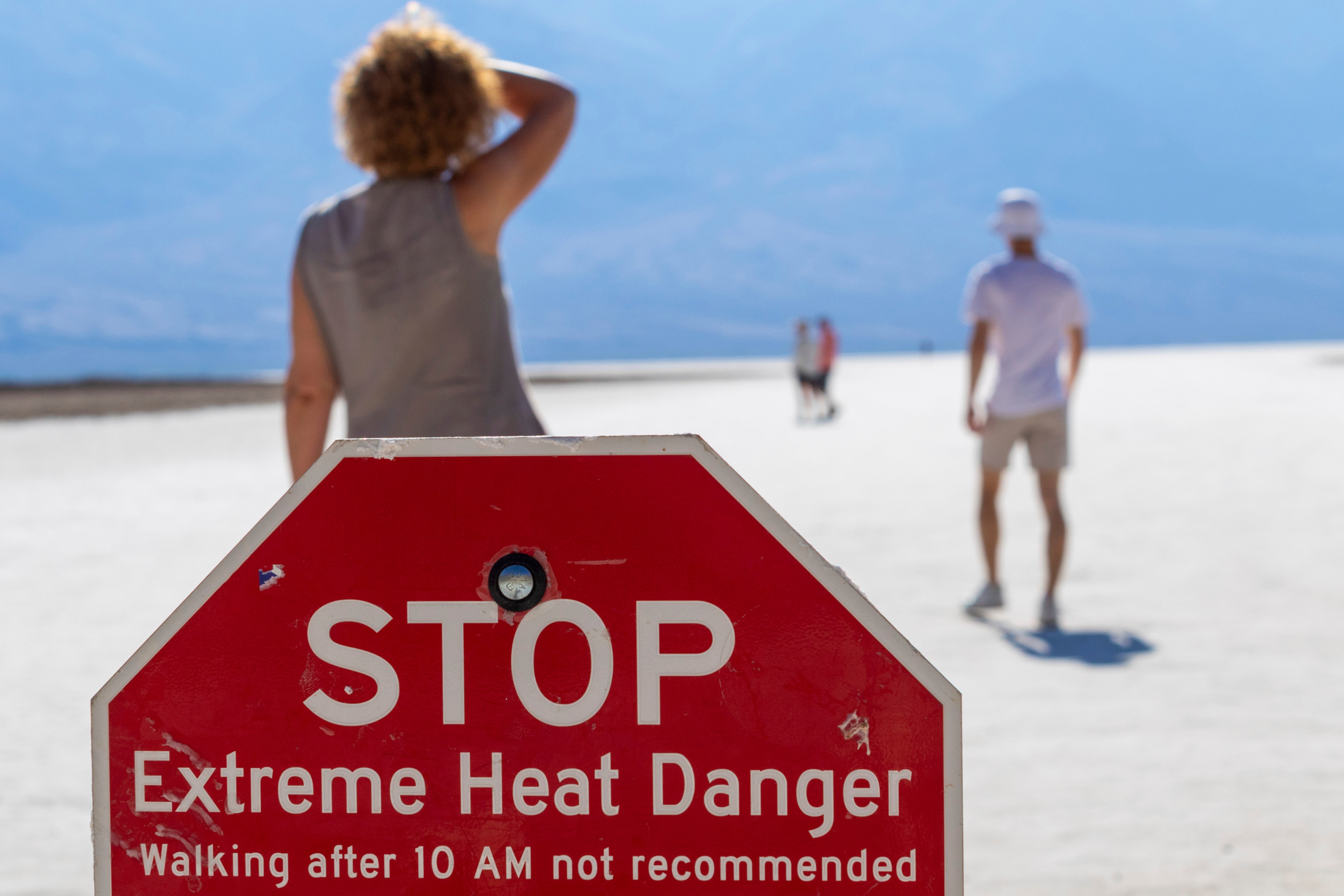 A visitor wipes sweat from their brow at Death Valley National Park’s Badwater Basin last July. The National Park Service said that the park had seen its hottest summer ever, with peak temperatures in July. More extreme heat is forecast to bake much of Southern California, including Los Angeles County