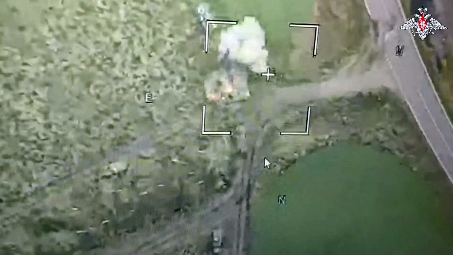 The image claims to show a Russian drone attack on a Ukrainian armoured vehicle which had entered Russian territory