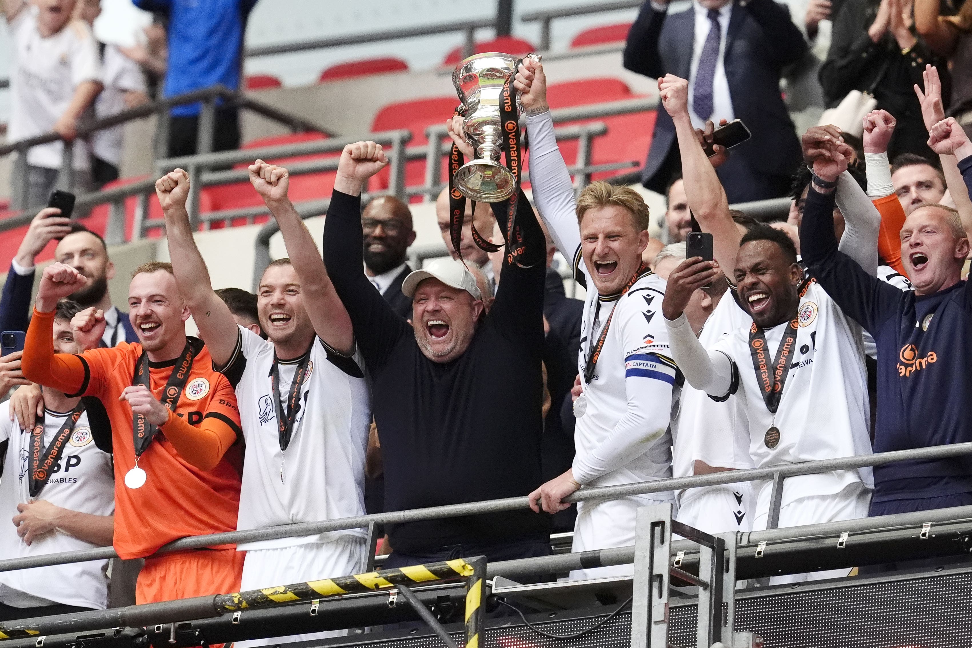 Bromley manager Andy Woodman (centre) celebrates promotion to Sky Bet League Two at Wembley (Nick Potts/PA)