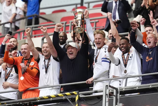 Bromley manager Andy Woodman (centre) celebrates promotion to Sky Bet League Two at Wembley (Nick Potts/PA)