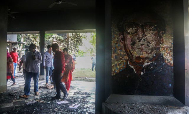 <p>Protesters gather in the house of former president Sheikh Mujibur Rahman, father of Sheikh Hasina, in Dhaka</p>