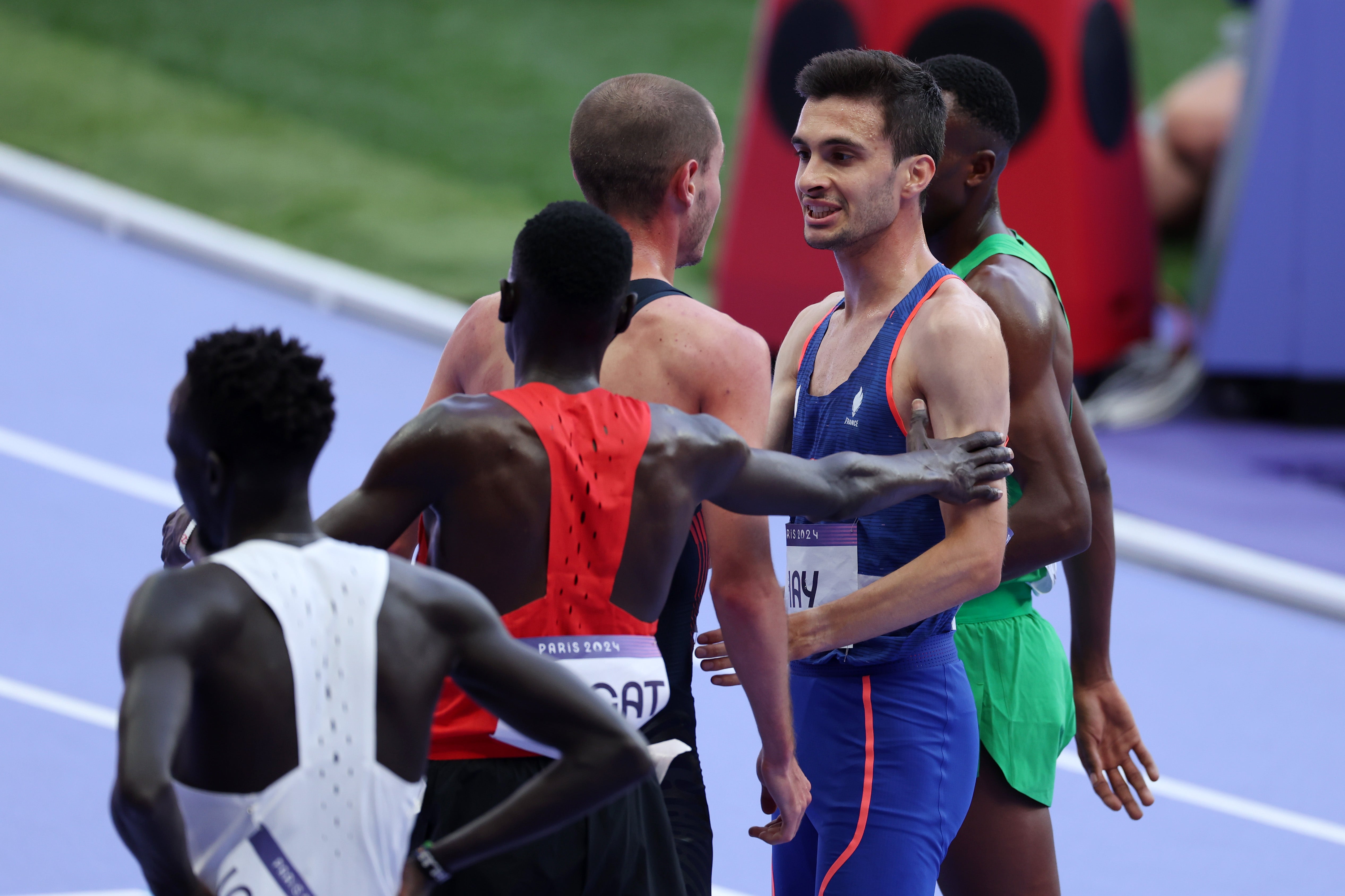 Hugo Hay of Team France and George Mills of Team Great Britain react