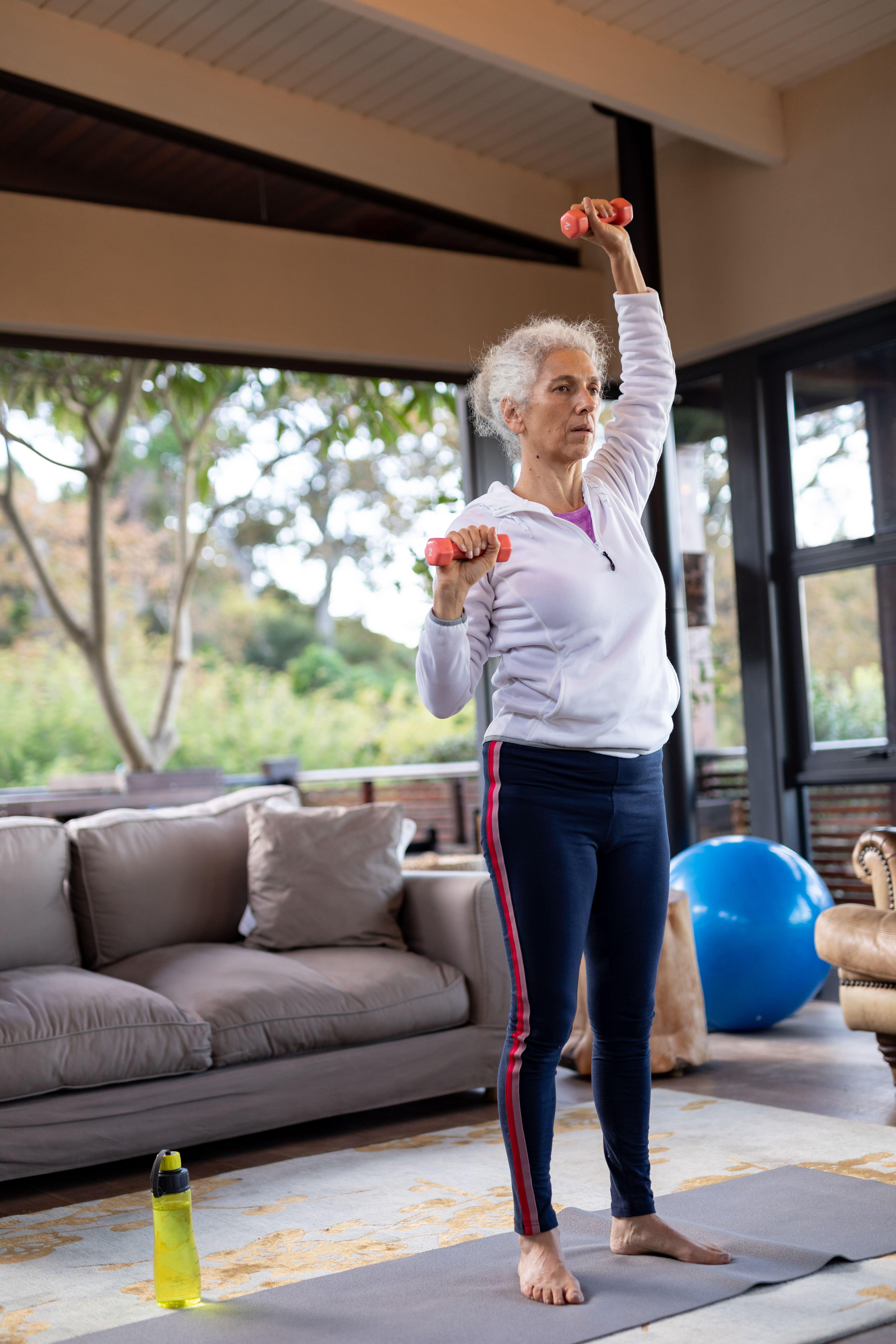 Incorporate some simple weight lifting exercises unto your routine (Alamy/PA)