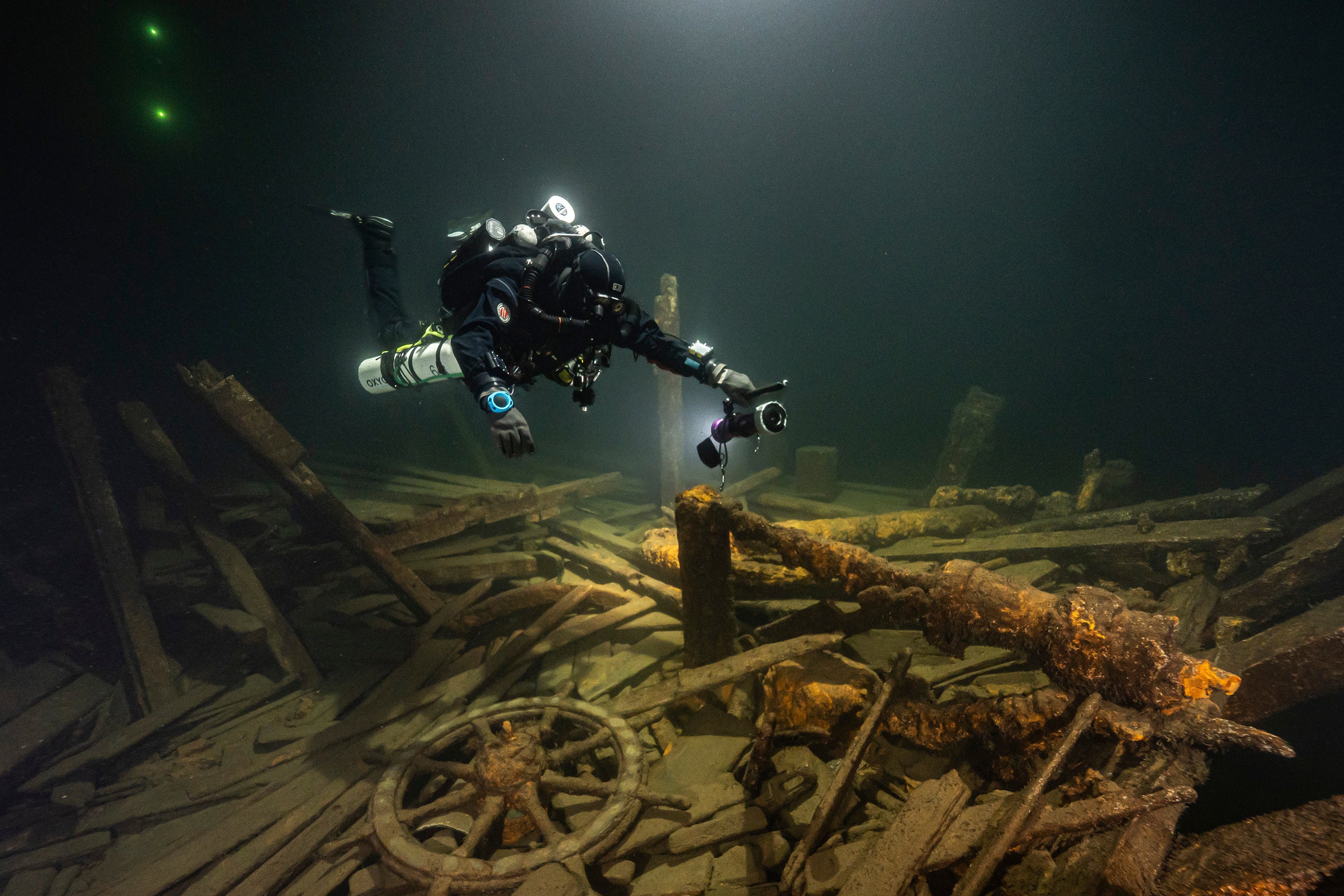 A diver from the Polish Baltictech team inspects wreckage of a 19th century sailing ship that the team discovered