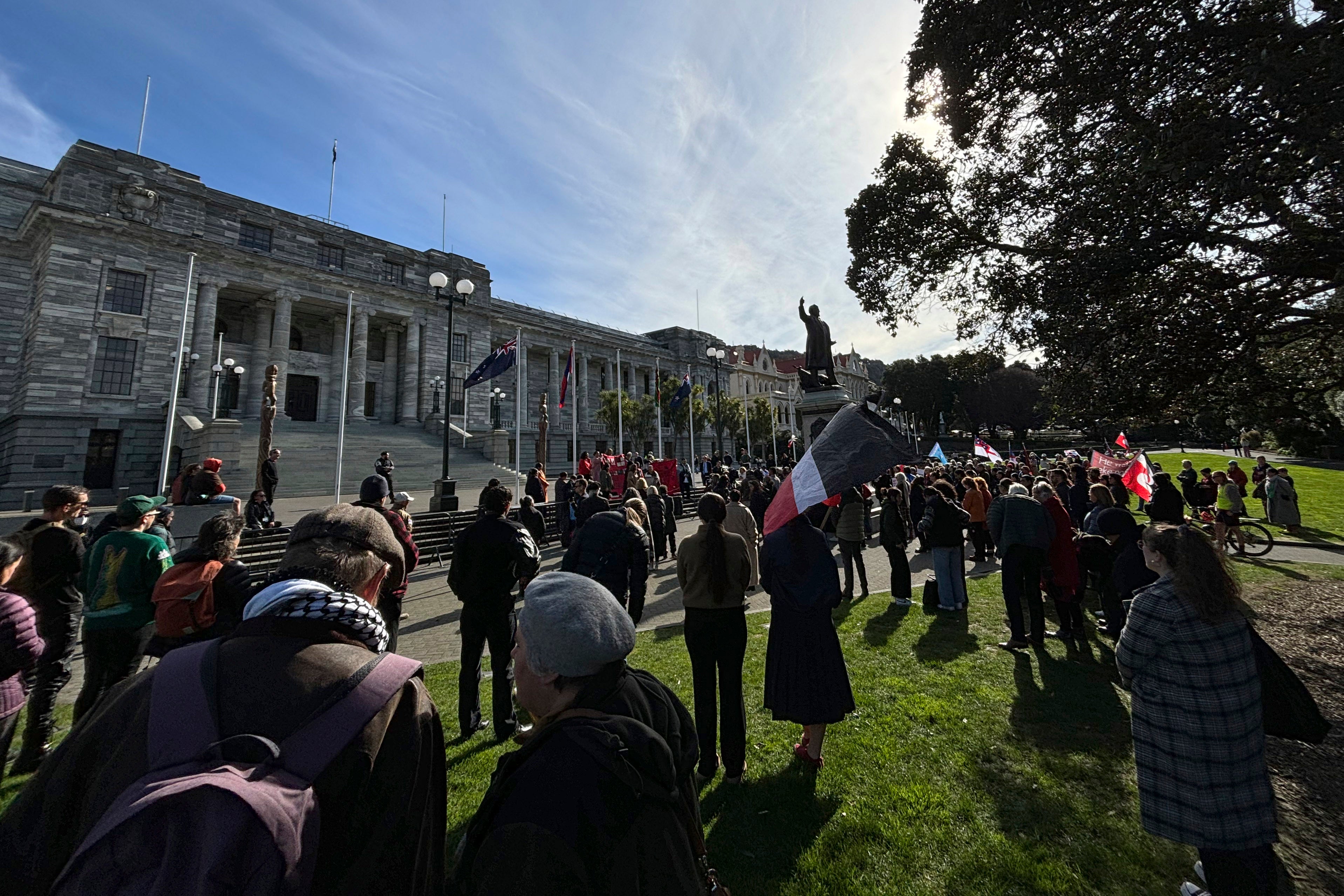 Protestors from the Māori iwi (tribe) Ngāpuhi and others gather outside the Parliament building in Wellington, New Zealand, Monday, Aug. 5 to protest the government’s plans to remove recognition of a child’s Māori heritage from the law governing the child protection system