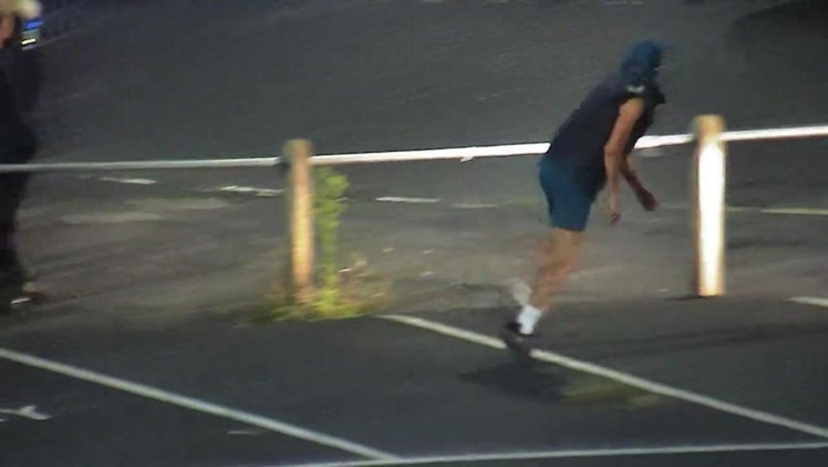 CCTV: Teenager caught celebrating after throwing bricks at police officers during UK riot