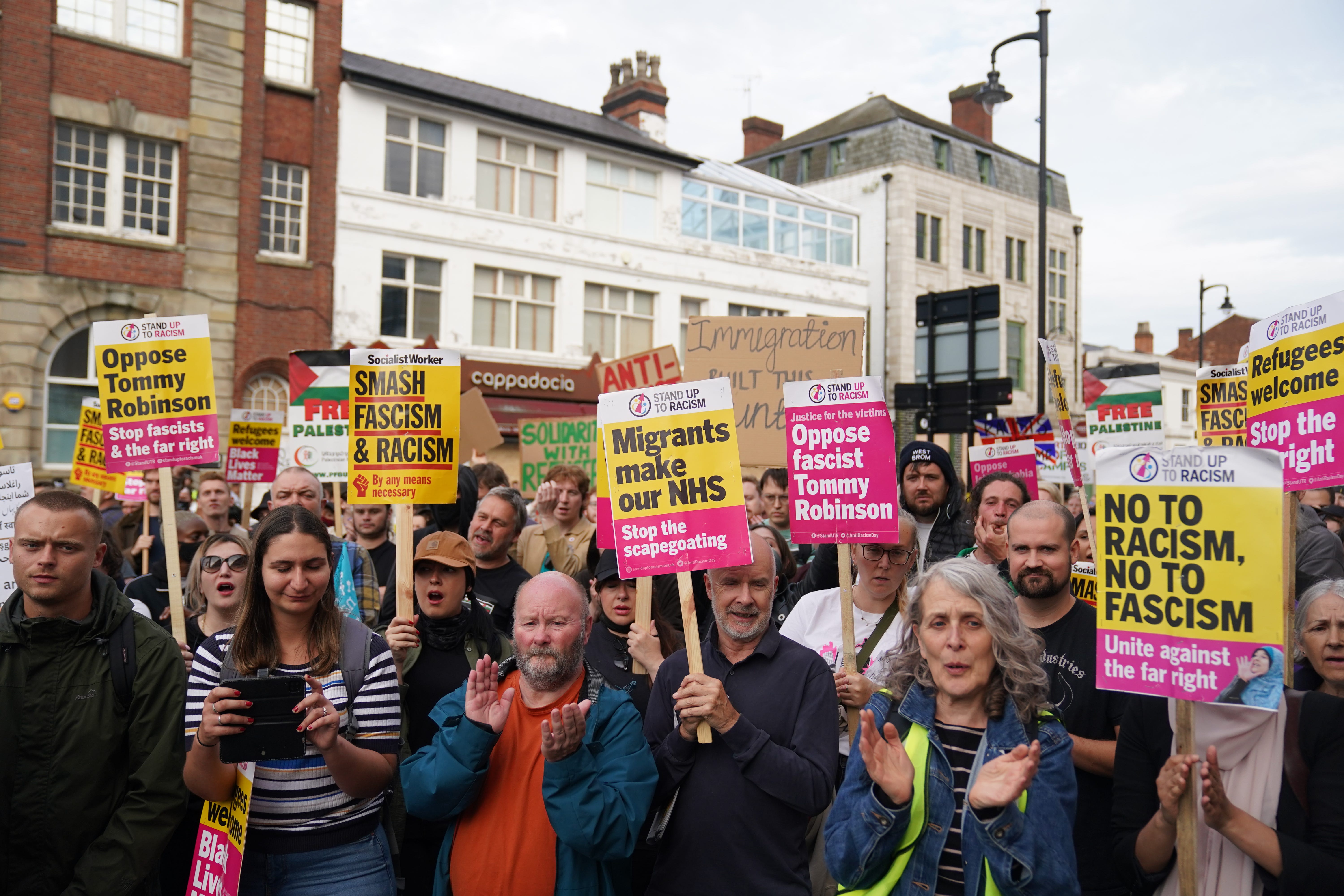 Counter protesters outside the Refugee and Migrant centre in Birmingham (PA)