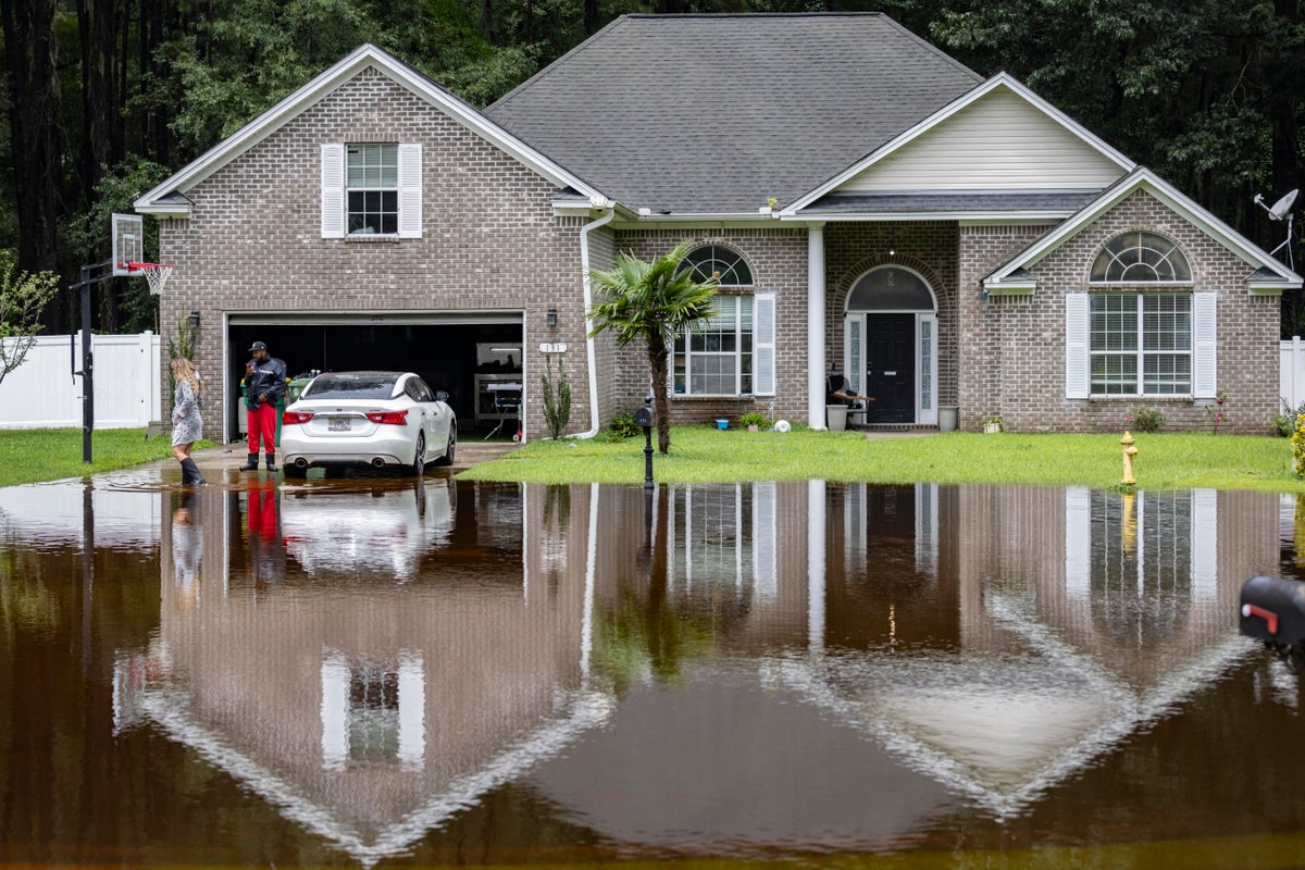Tropical rains flood homes in an inland Georgia neighborhood for the ...