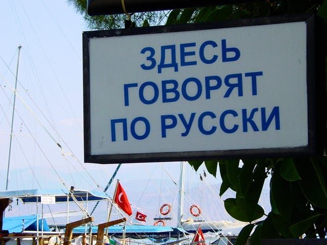 <p>‘Russian spoken here’: a sign outside a business in Fethiye, southern Turkey</p>