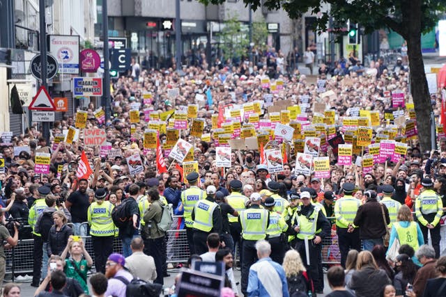 <p>Thousands of counterprotesters demonstrated peacefully on Wednesday night ahead of expected anti-immigration action</p>