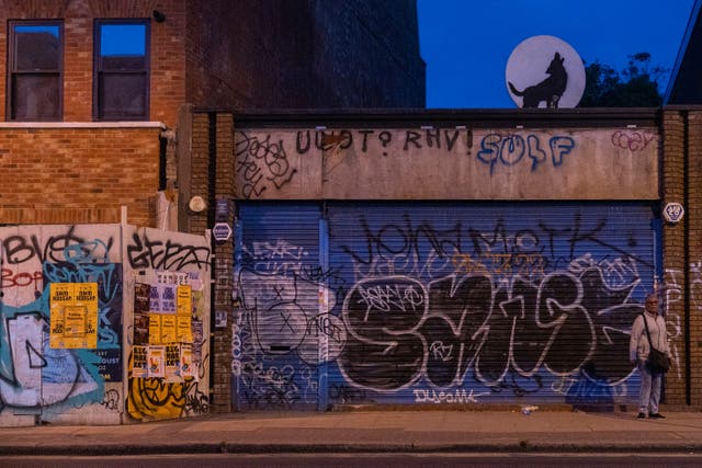 Wolf silhouette by Banksy (Pest Control/PA)