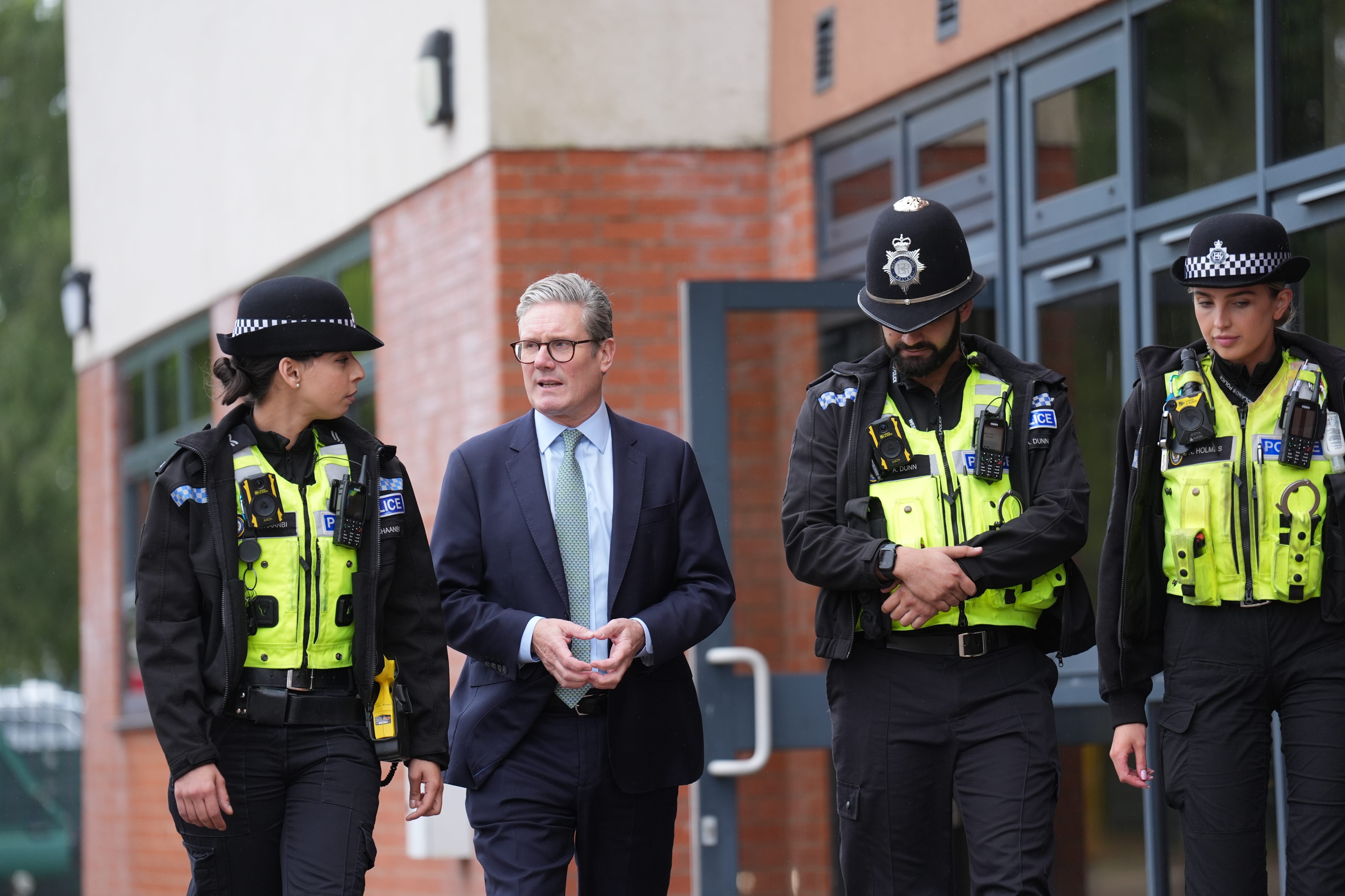 Sir Keir Starmer speaks with members of the West Midlands Police Force at Arden Academy in Solihull