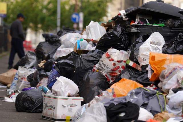 A strike by waste and recycling workers in 2022 led to rubbish piling up in the streets of Edinburgh during the festival period (Andrew Milligan/PA)