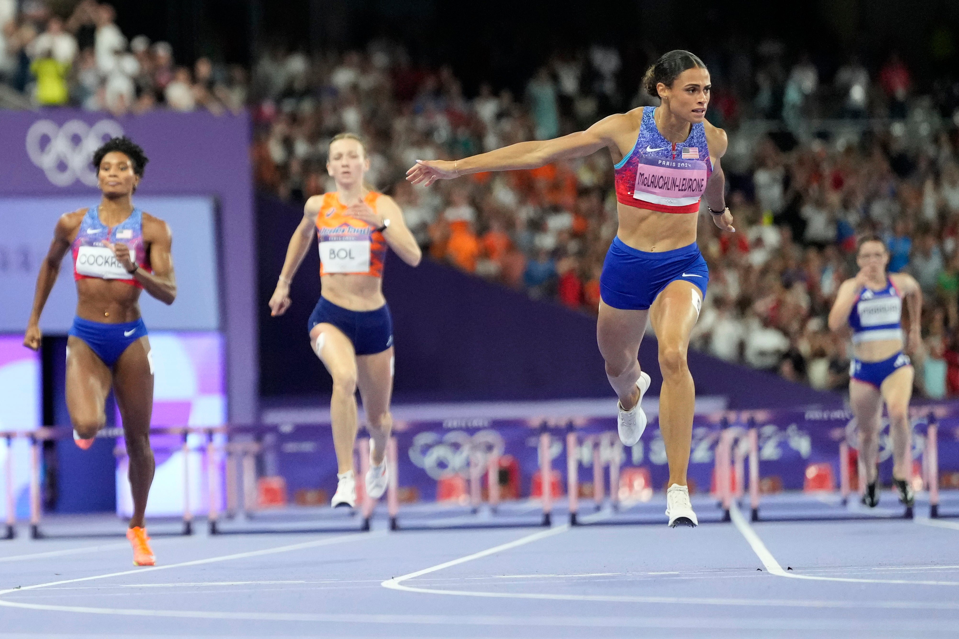 Sydney McLaughlin-Levrone crosses the finish line and wins gold