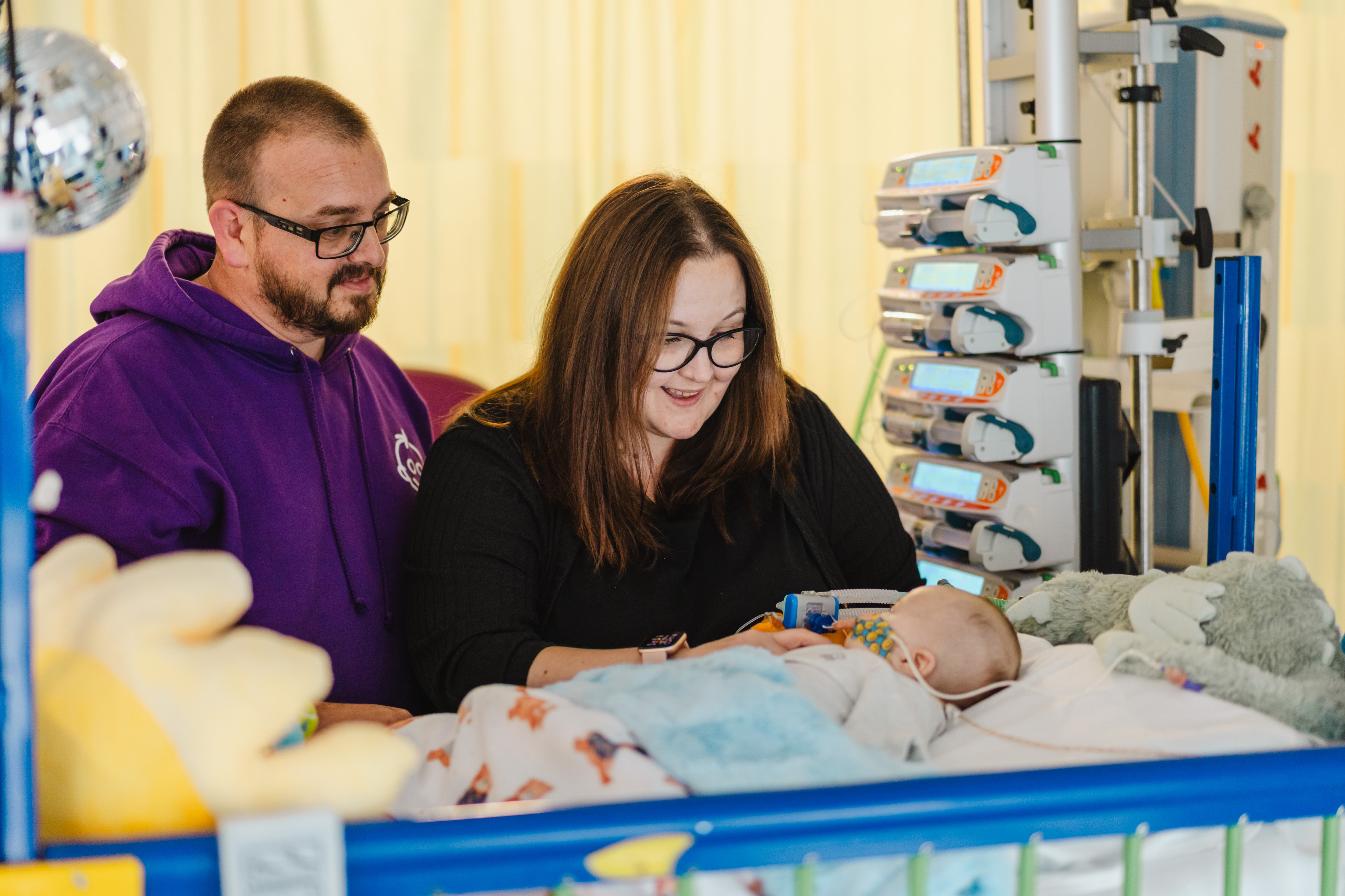 Stuart Jones and Laura Osborne with their 11-week old son William Jones. He is on the list for an urgent heart transplant after being diagnosed with a disease of the heart muscles just weeks after his birth in May (Great Ormond Street Hospital/PA)