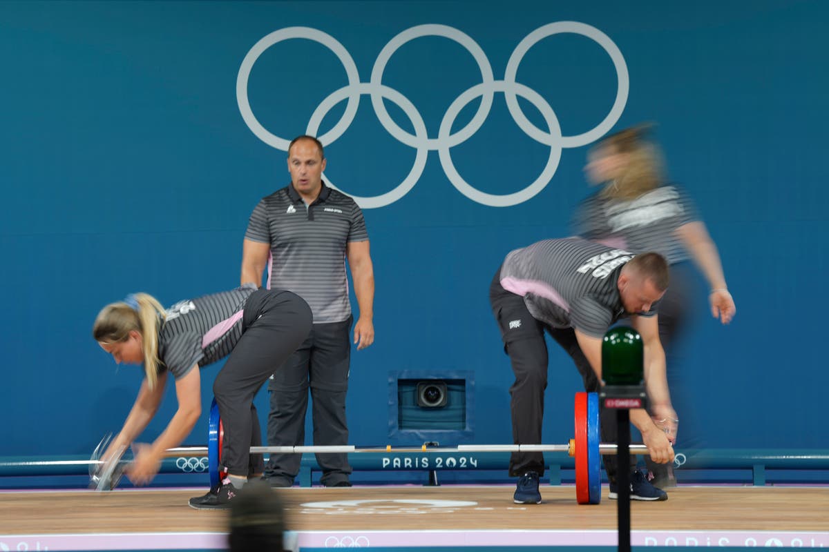 Like pit crews, but in weightlifting. How loaders keep Olympic sports going