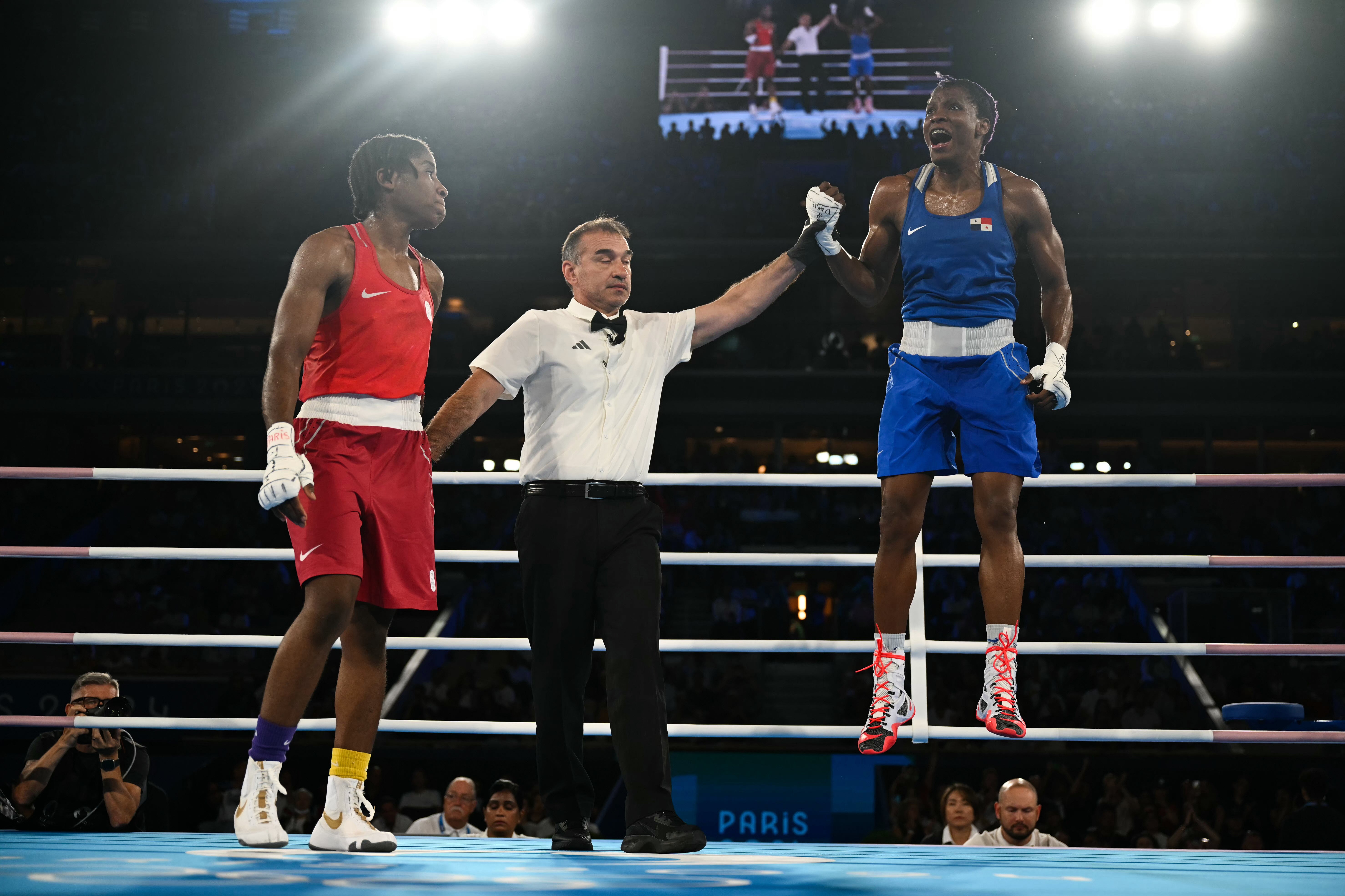 Ngamba (left) reacts after losing her semi-final to Panama’s Atheyna Bylon