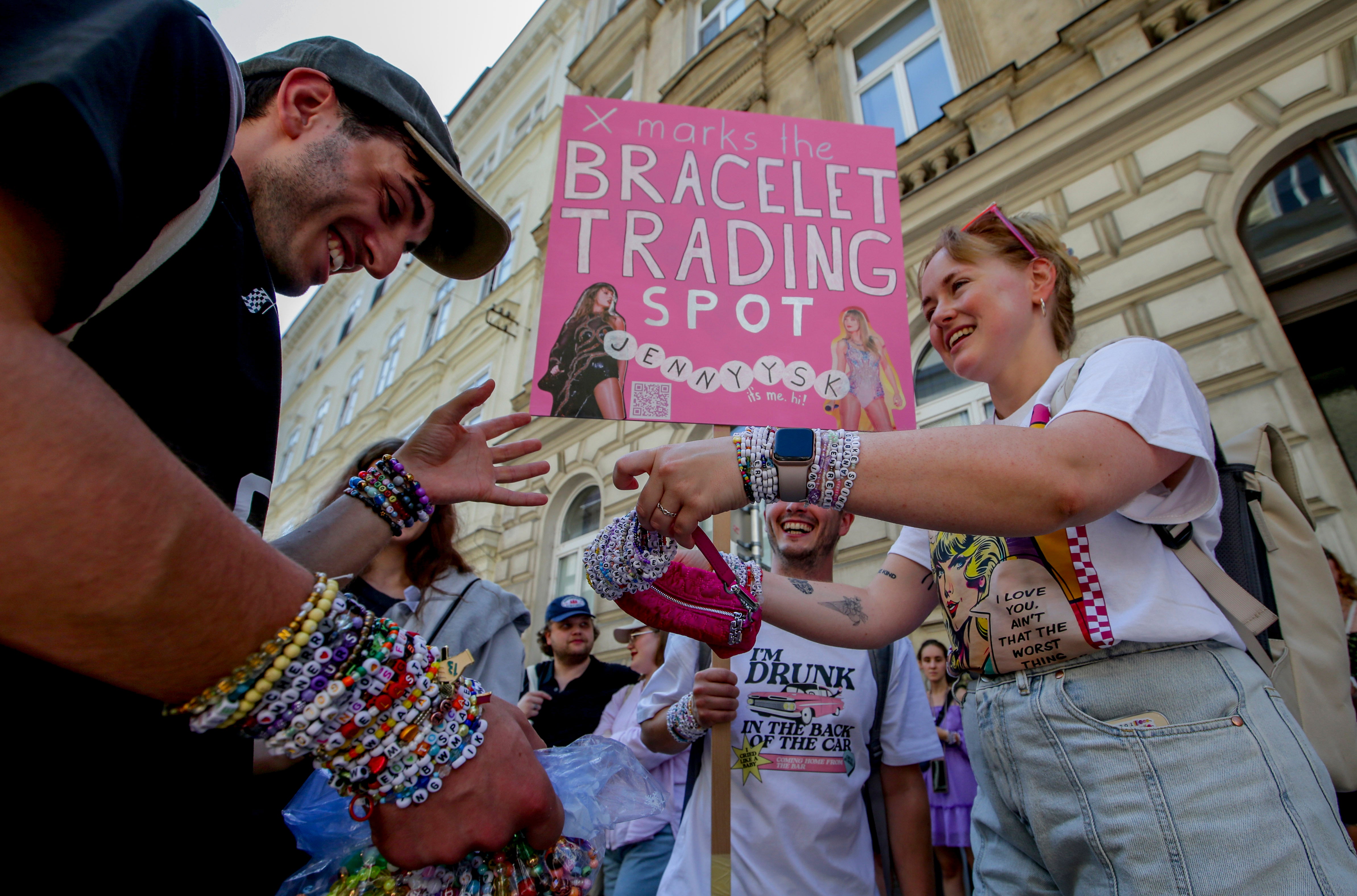 Taylor Swift fans who had already arrived in Austria tried to make the best of a bad situation and celebrate their love of the singer regardless by trading friendship bracelets.