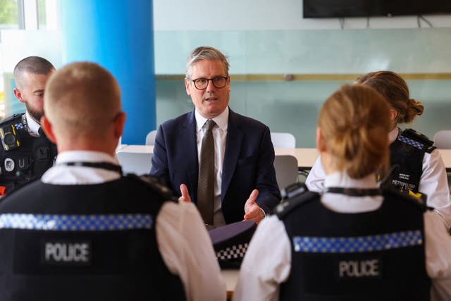 <p>The Prime Minister met with police officers on Friday (Toby Melville/PA)</p>