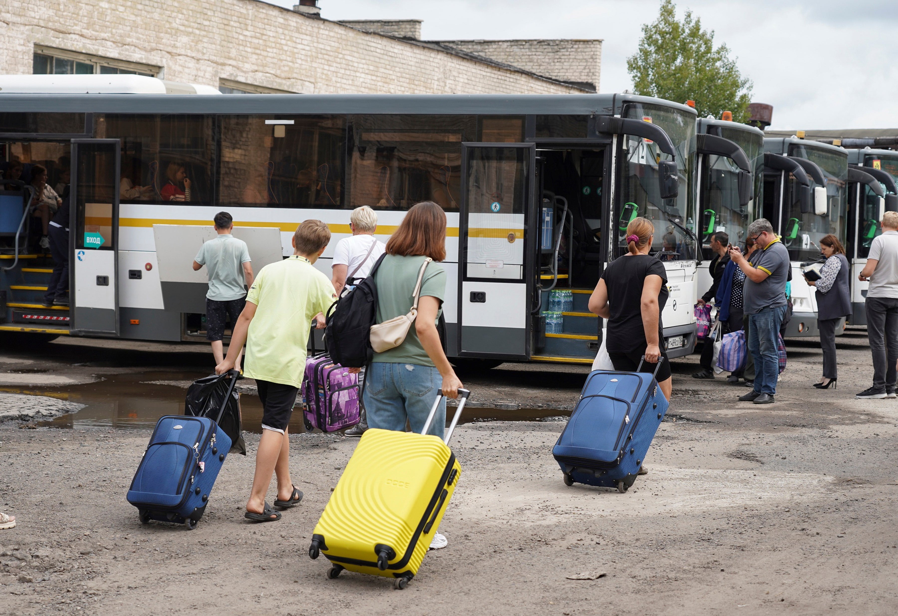 Kursk region of Russia shows people from the border districts of the Kursk region boarding buses to travel to children's camps in the Moscow region