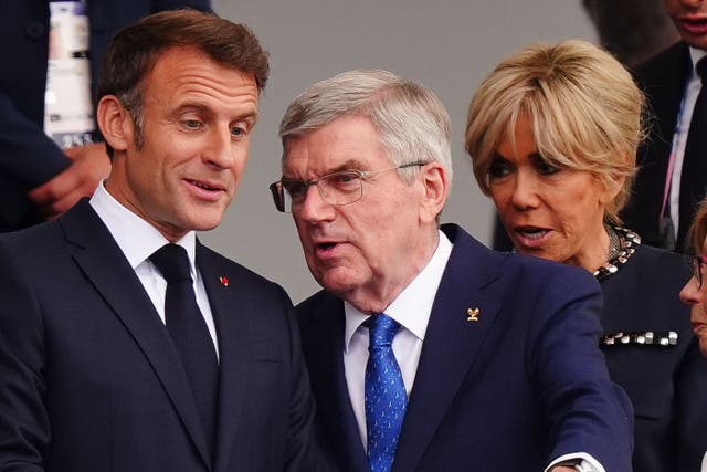 Thomas Bach (centre) with the President of France Emmanuel Macron on the left (PA)