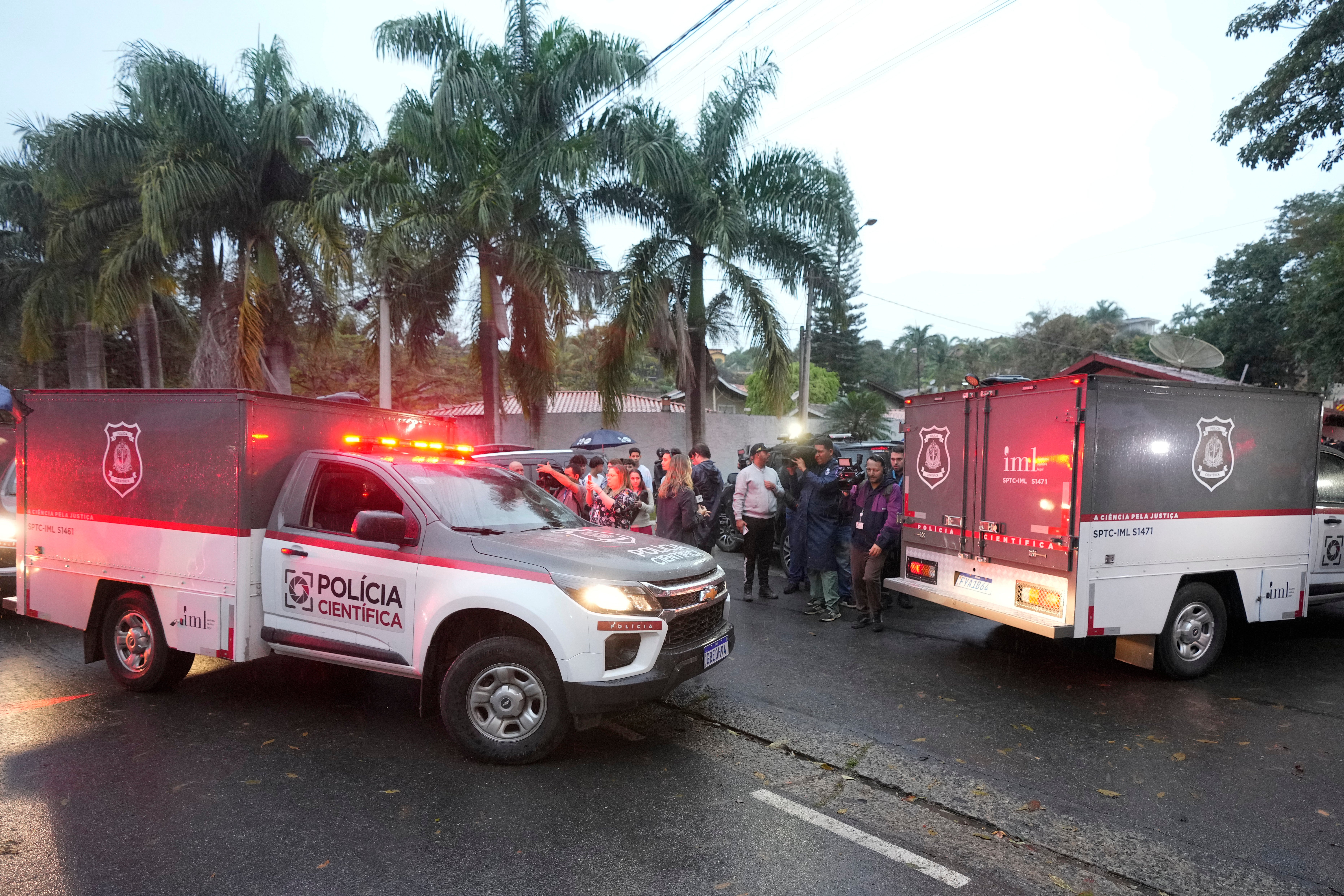 Ambulances sit outside the neighborhood where VoePass flight 2283 crashed in Vinhedo. The plane fell thousands of feet in less than two minutes