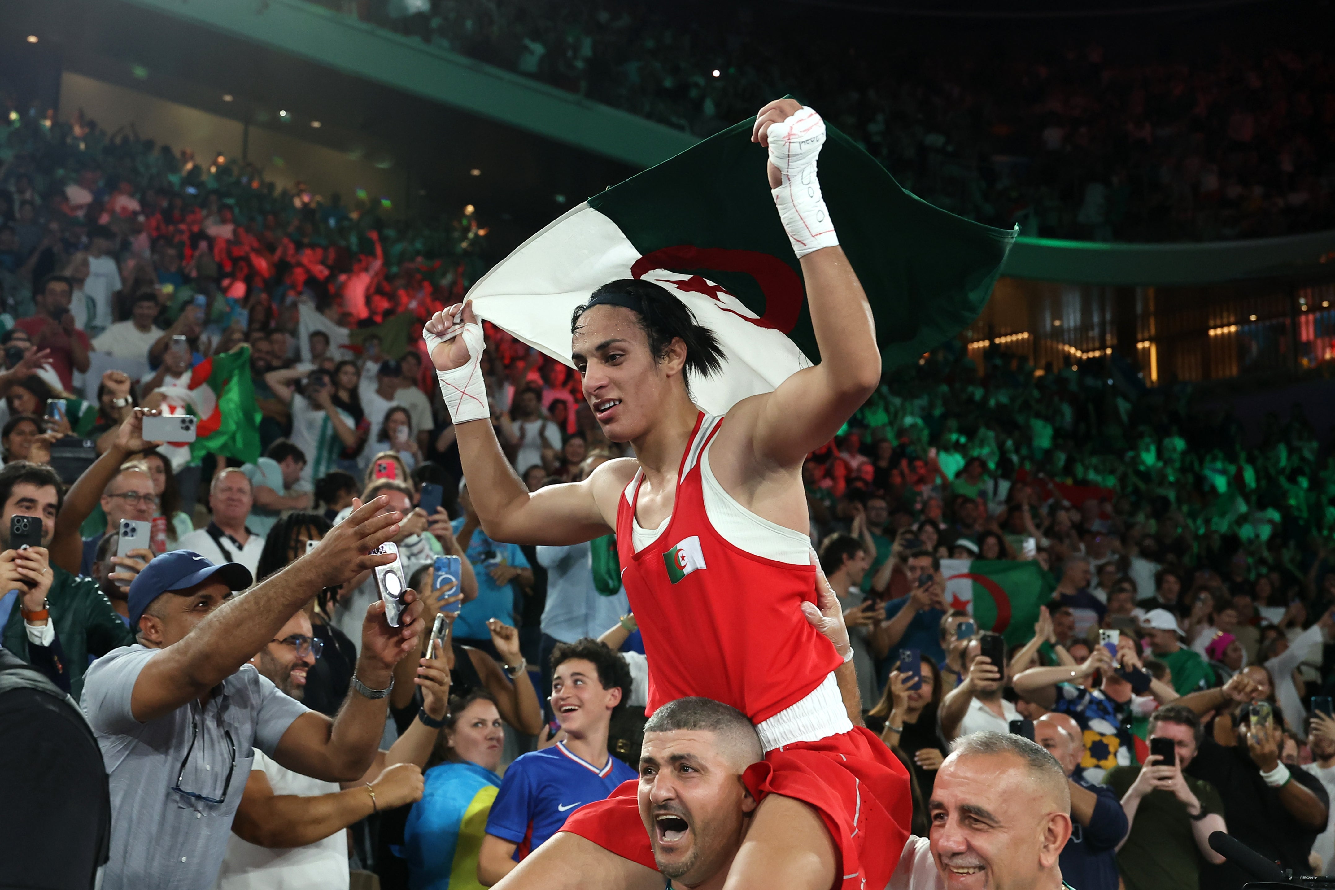 Khelif celebrates her gold medal with Algeria fans in Paris