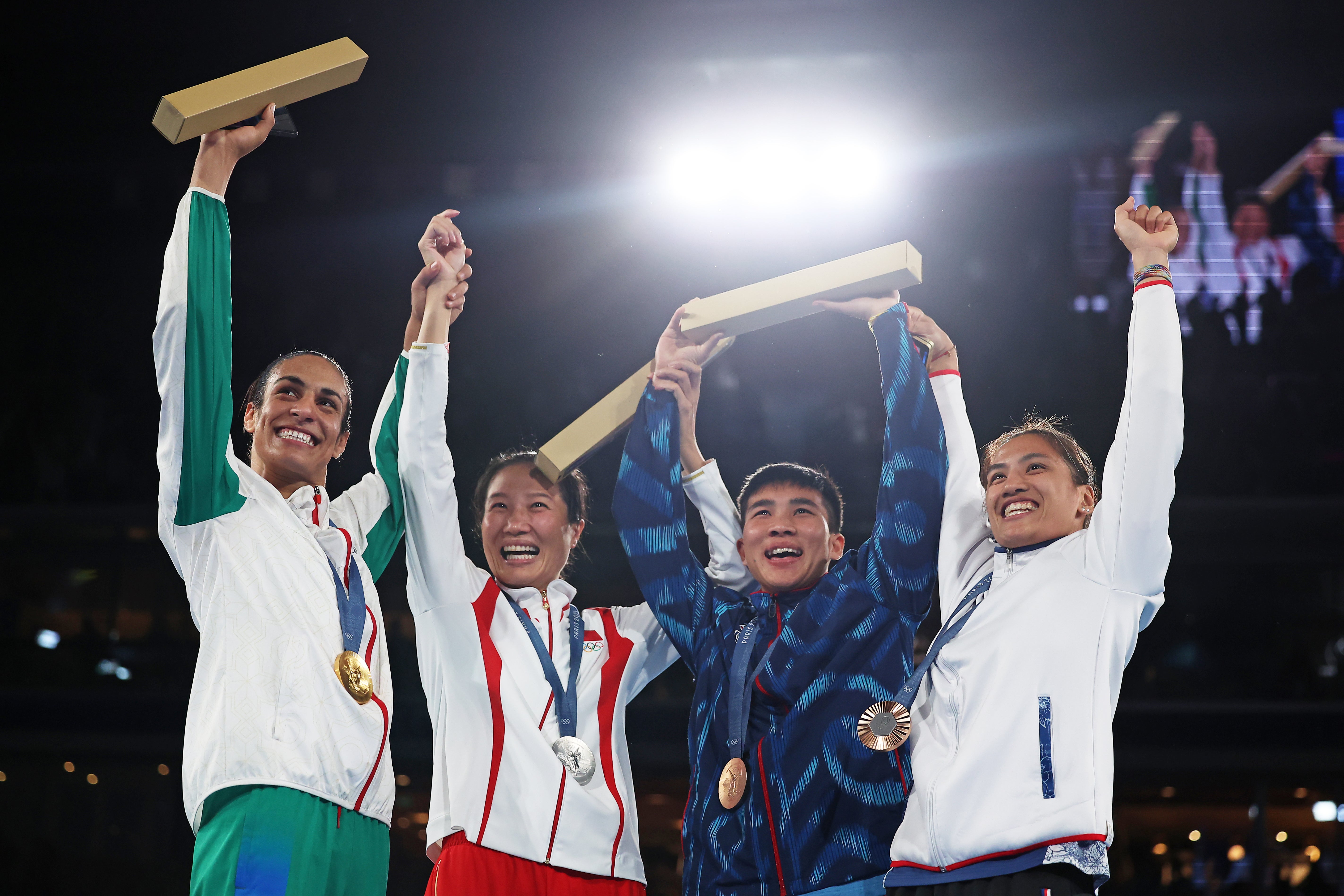 Imane Khelif (left) with her fellow Olympic welterweight medalists