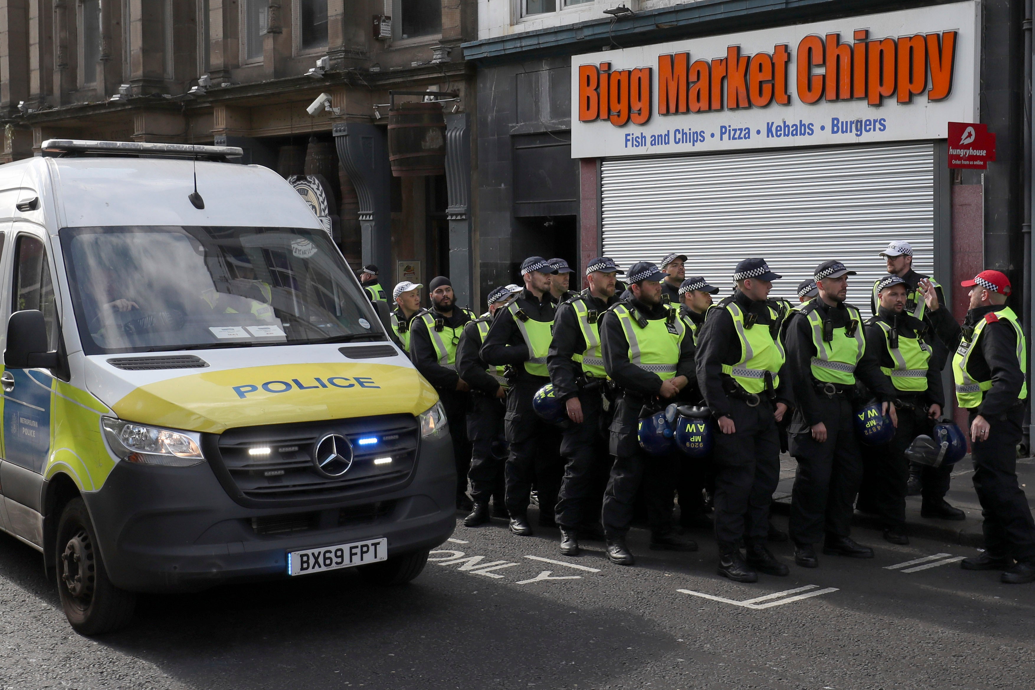 Police forces with riot gear prepare for a far-right anti-immigration protest in Newcastle on Saturday