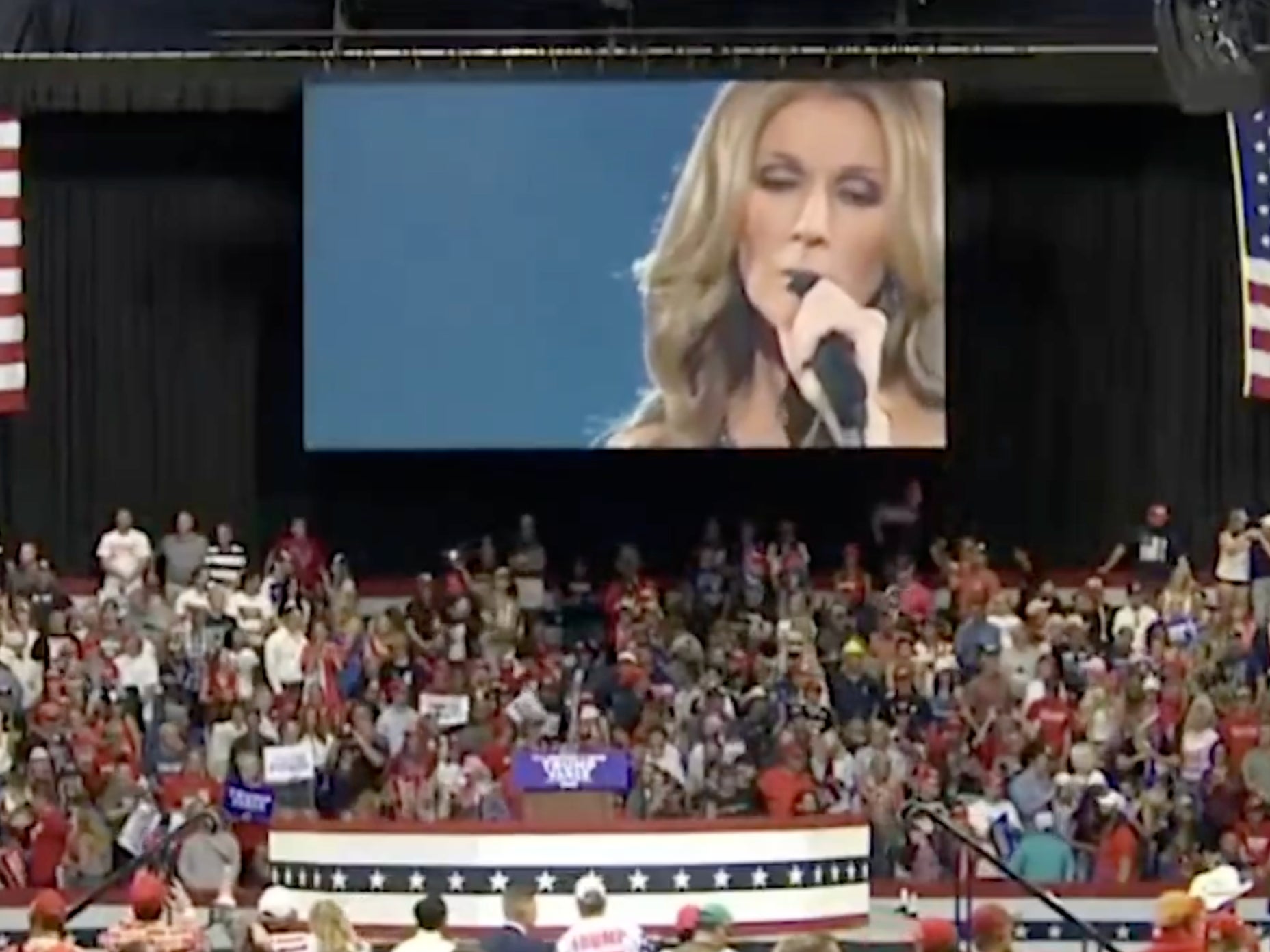 Donald Trump supporters watch the song playing 