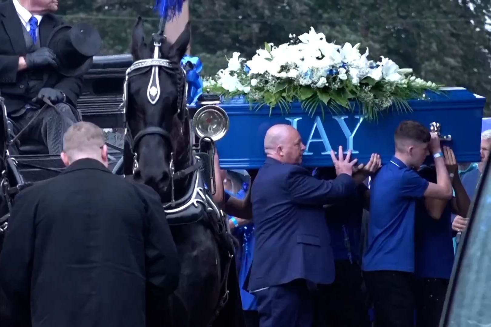 The coffin of Jay Slater being carried into Accrington Cemetery Chapel in Lancashire on 10 August.