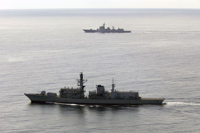 HMS Richmond in the foreground accompanying Chinese destroyer Jiaozuo through the English Channel (Ministry of Defence/PA)