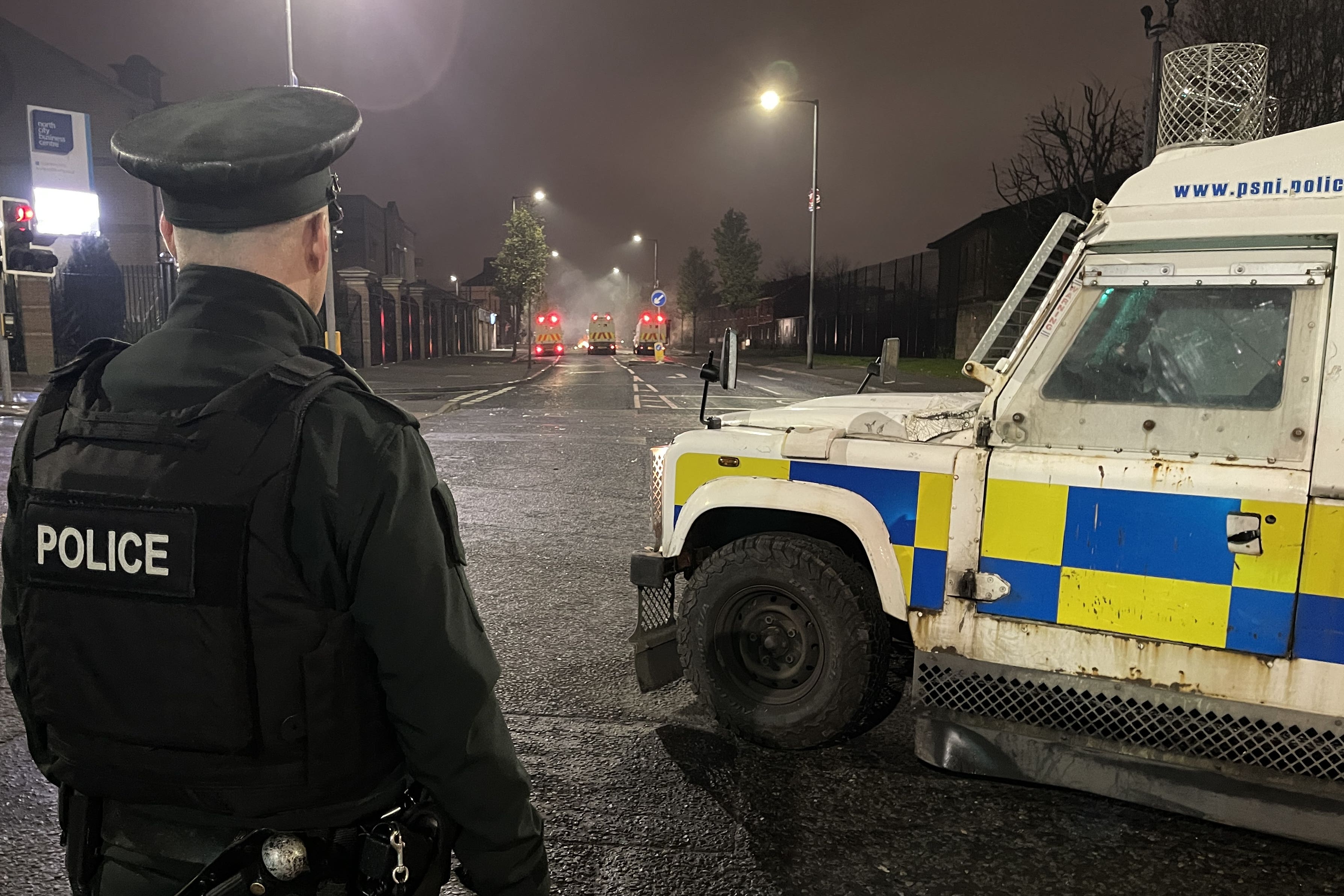 A PSNI officer and vehicle (Liam McBurney/PA)