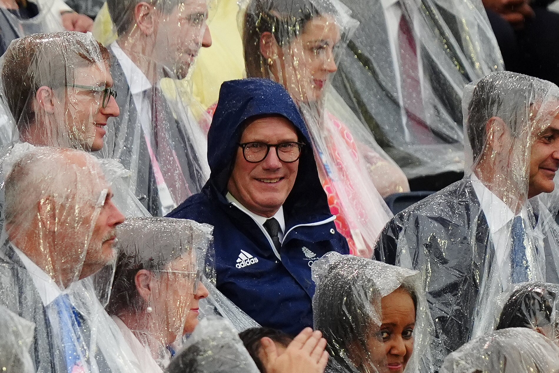 Rain cast a shadow over the opening ceremony, with dignitaries including Prime Minister Sir Keir Starmer forced to cover up (PA)