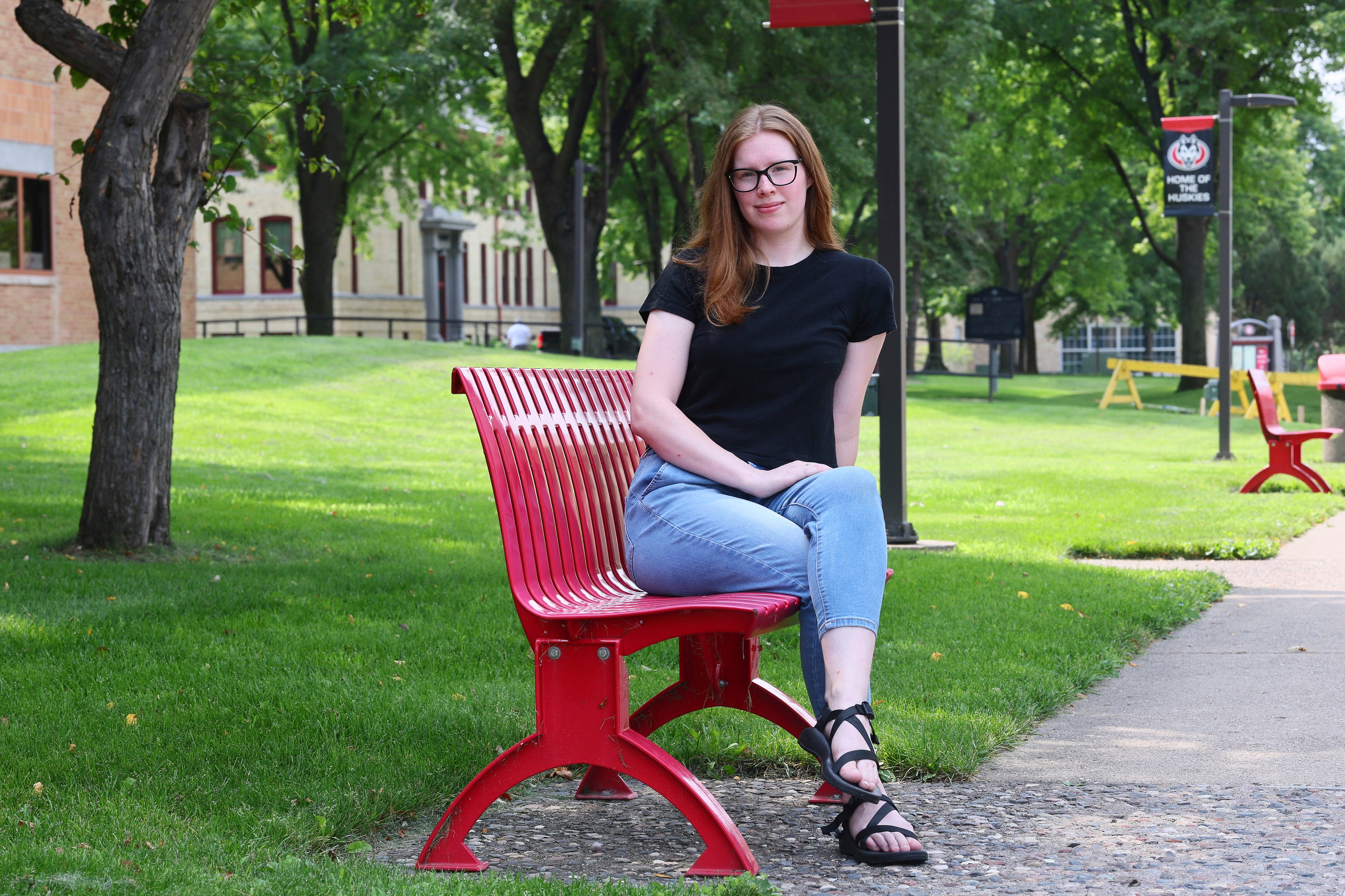 University student Christina Westman poses at St. Cloud State University. She and other students are feeling the impact of budget cuts and program reductions on college campuses.