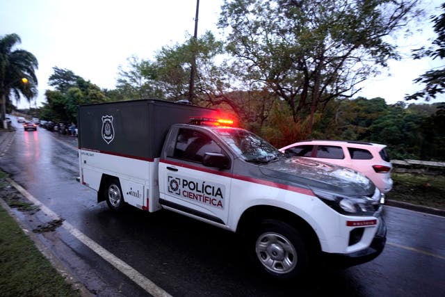 <p>A police vehicle used to carry bodies where a plane crashed in Vinhedo, Sao Paulo state, Brazil</p>