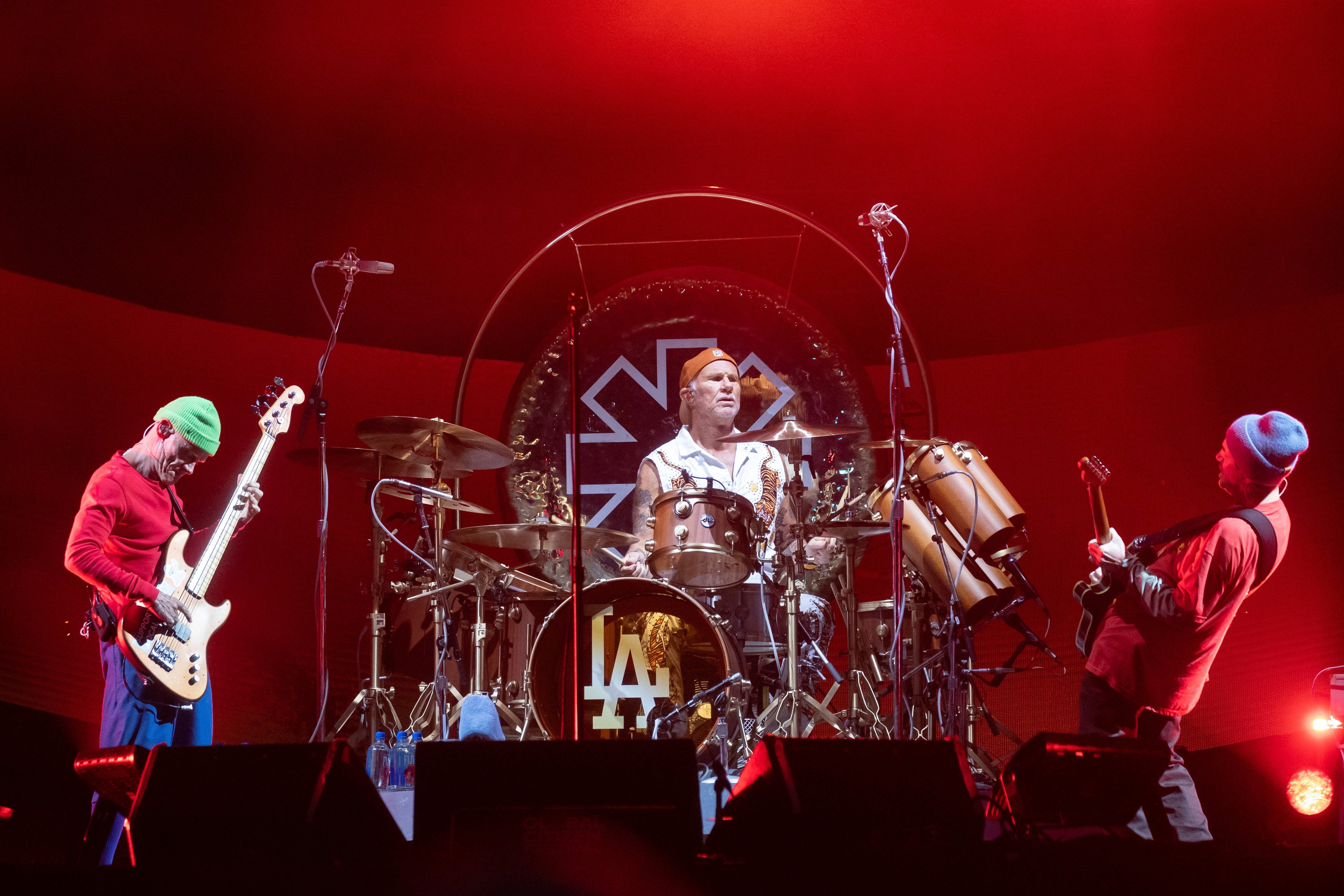 Members of the Red Hot Chili Peppers from left to right, Flea, Chad Smith, and John Frusciante perform during the Global Citizen Festival on Sept. 23, 2023