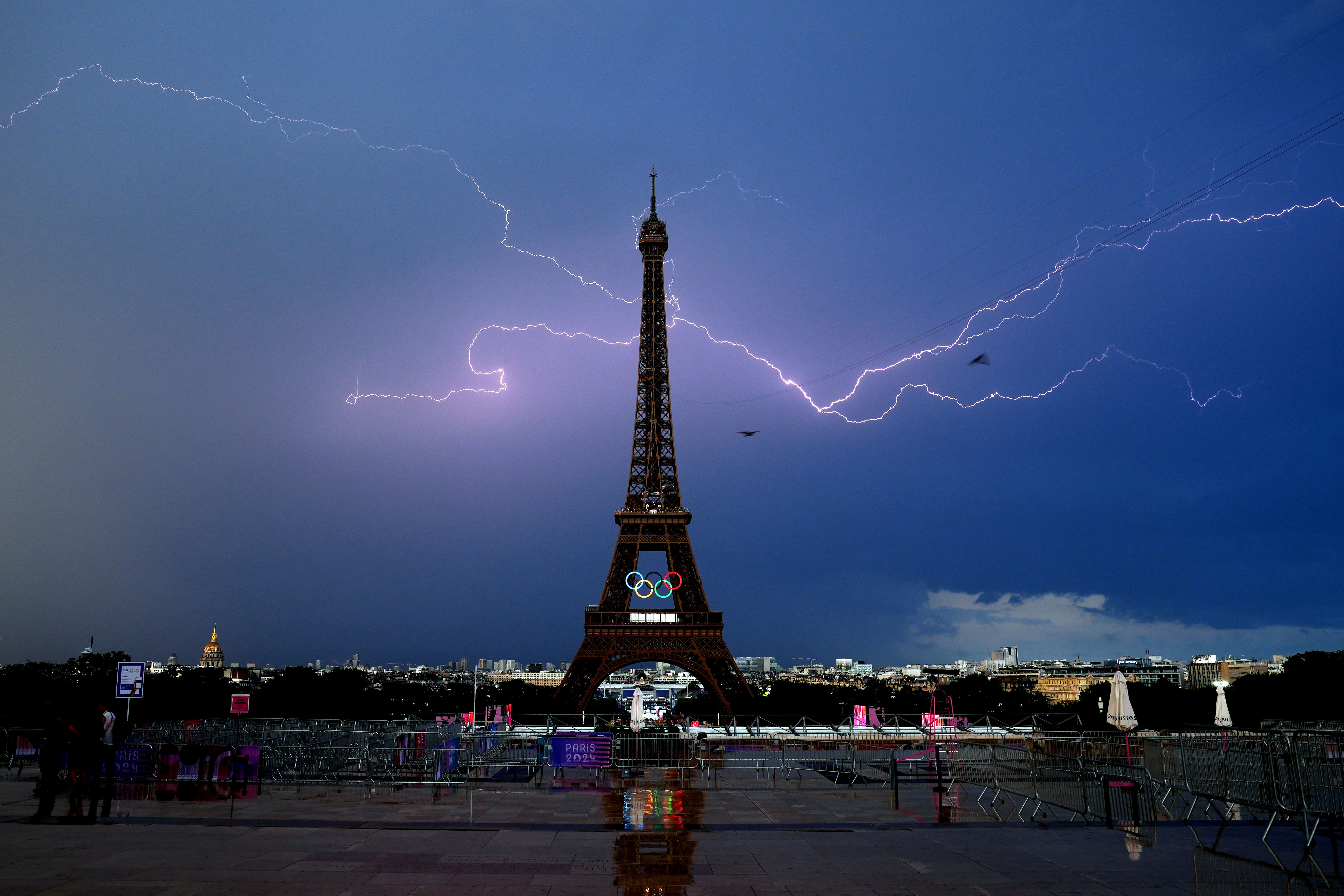 Lightning strikes near the Eiffel Tower, ahead of the start of men’s 20km race walk at the Paris Olympics (David Davies/PA).