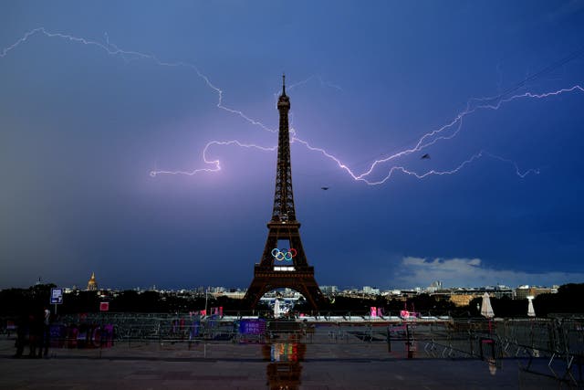 Lightning strikes near the Eiffel Tower, ahead of the start of men’s 20km race walk at the Paris Olympics (David Davies/PA).