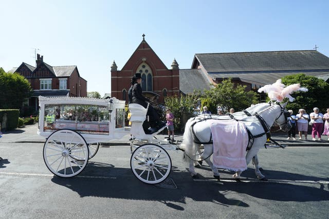 The horse-drawn carriage carrying the coffin of Southport stabbing victim Alice da Silva Aguiar arrives for her funeral at St Patrick’s Church, Southport (Danny Lawson/PA)