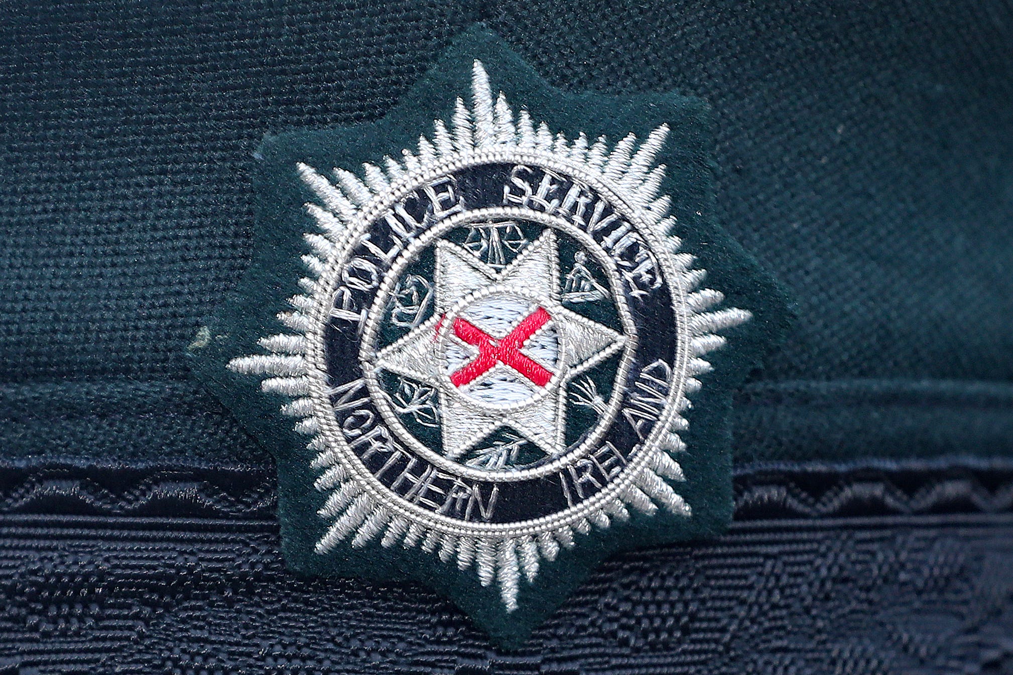 A stock picture of a Police Service of Northern Ireland (PSNI) logo badge (Niall Carson/PA)