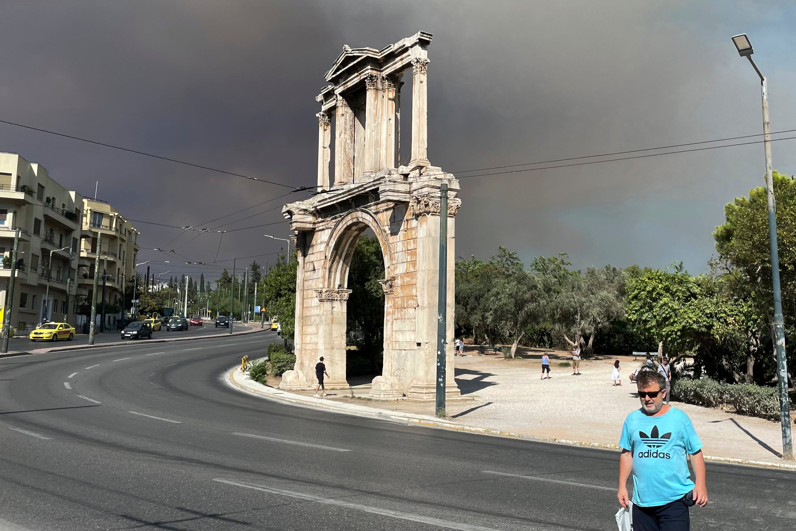 Smoke from wildfires is seen above Hadrian's Arch in central Athens, Sunday, on 11 August 2024