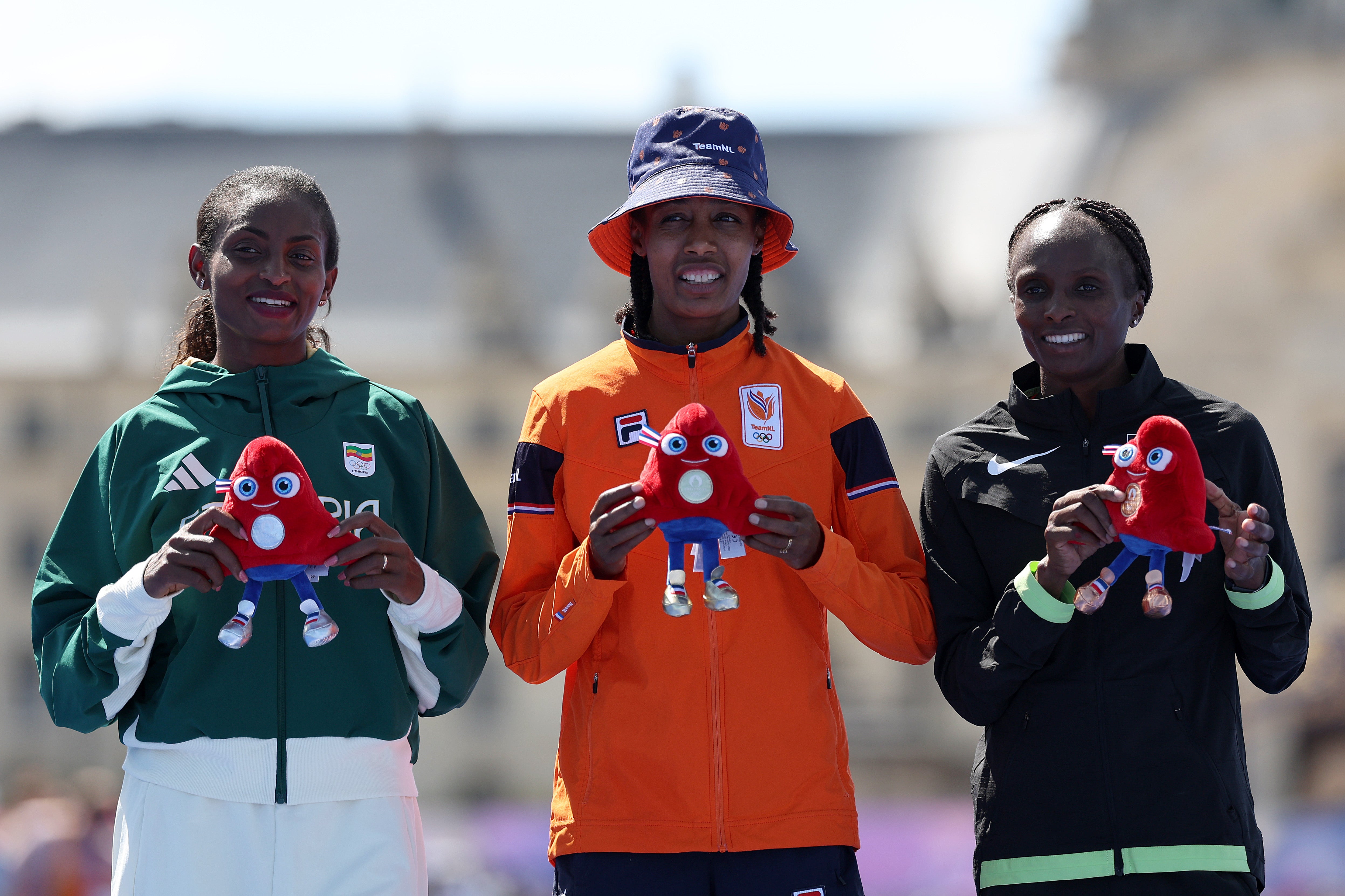 Hassan alongside runner-up Tigst Assefa (left) and third-placed Hellen Obiri