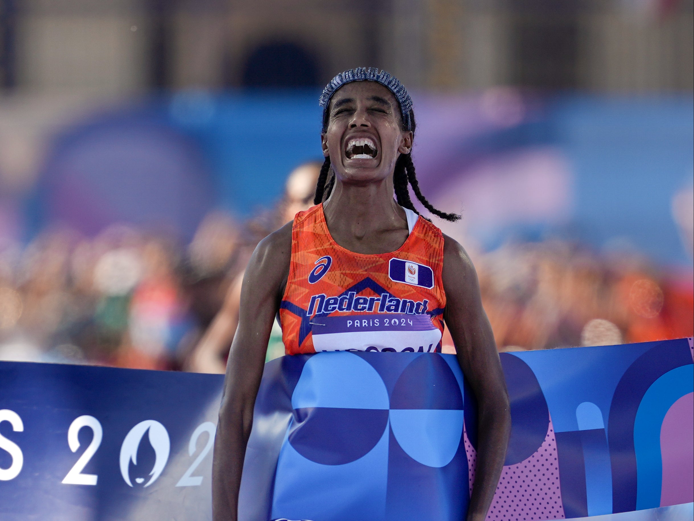 Sifan Hassan, of the Netherlands, celebrates after crossing the finish line