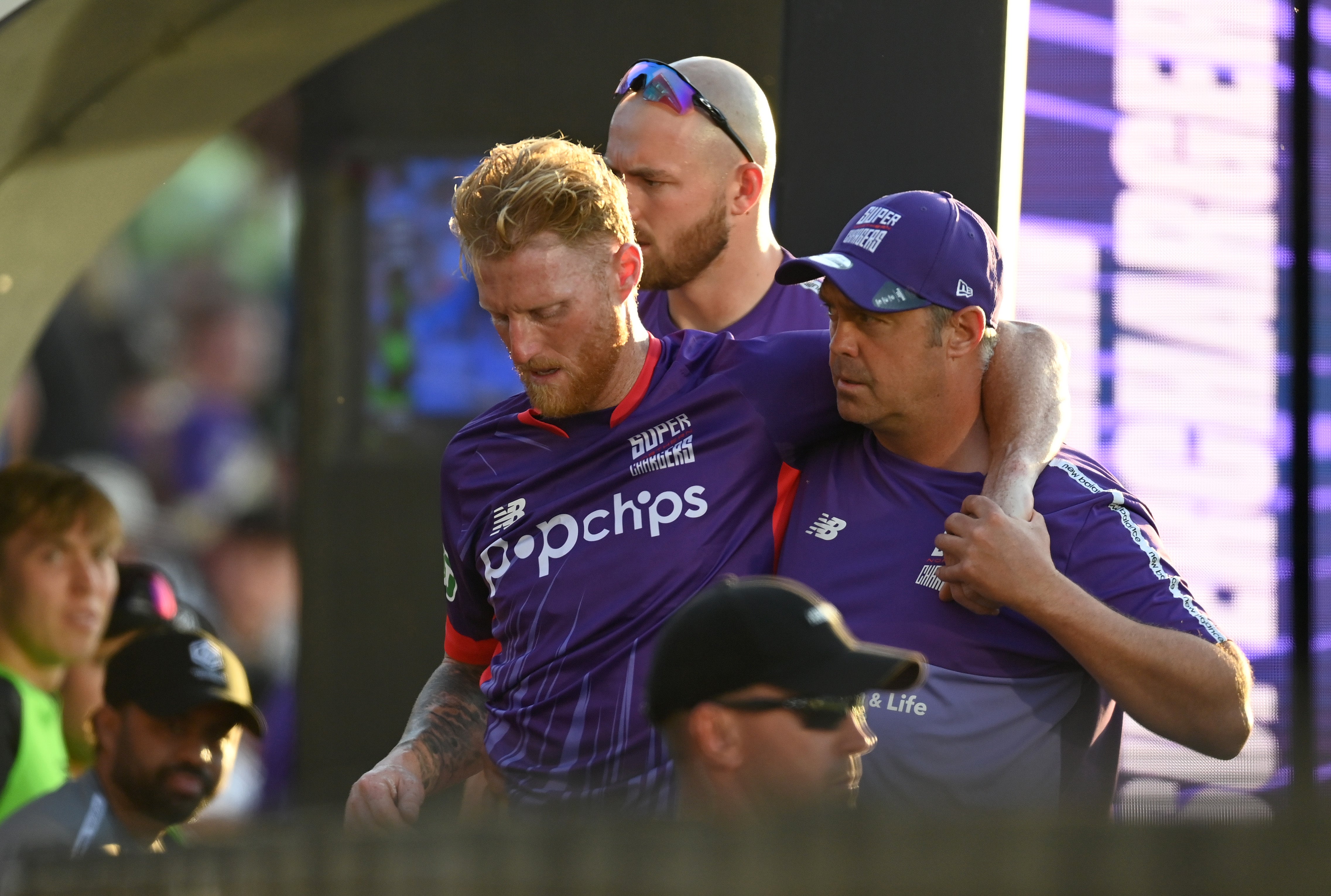 Ben Stokes of Northern Superchargers is carried from the field after picking up an injuryduring The Hundred match between Manchester Originals and Northern Superchargers at Emirates Old Trafford