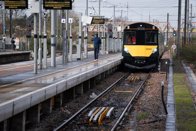 <p>A train pulls into a station platform
</p>