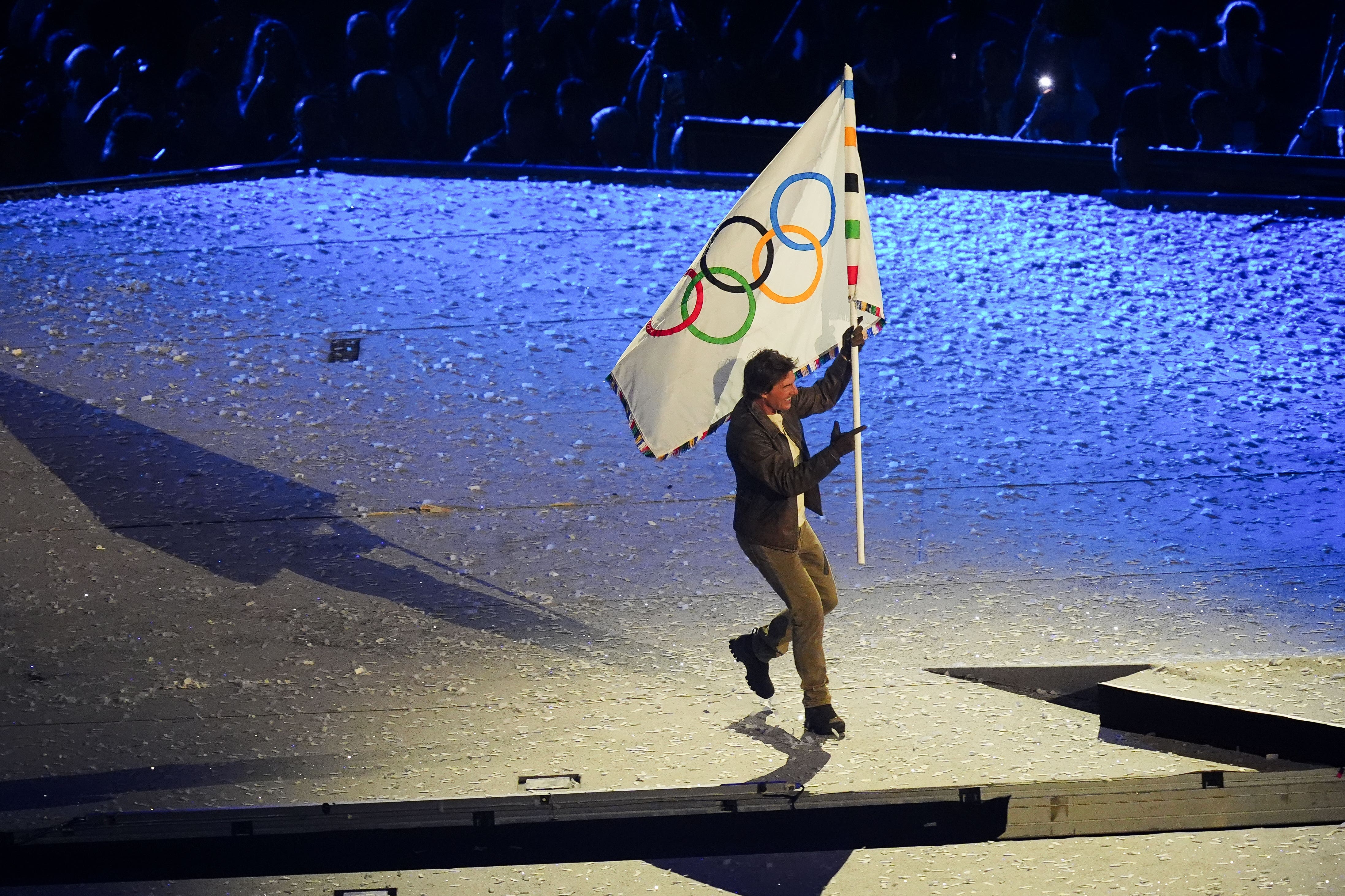 Tom Cruise with the Olympic Flag during the closing ceremony of the 2024 Paris Olympic Games (David Davies/PA)