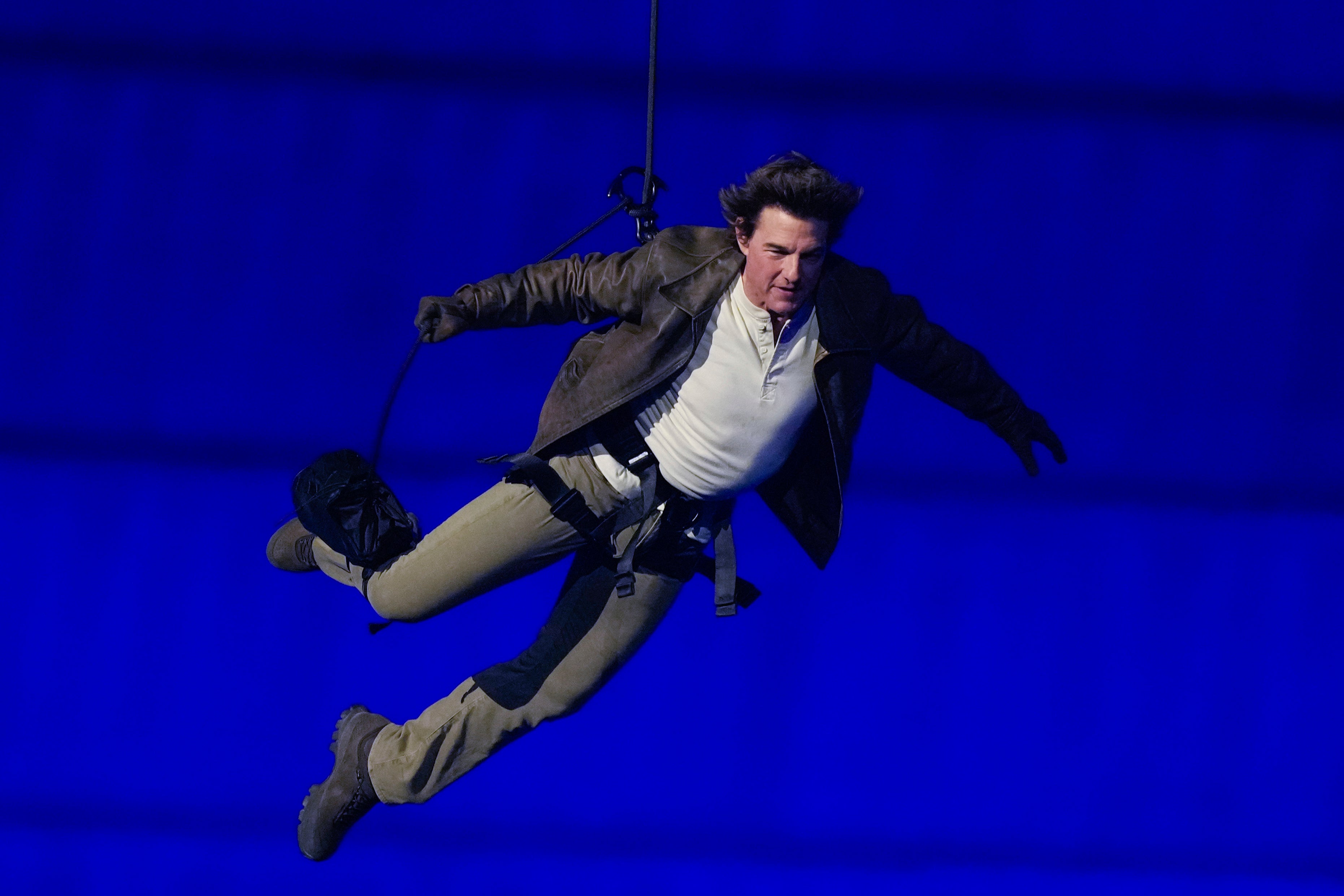 Tom Cruise floats into the Stade de France